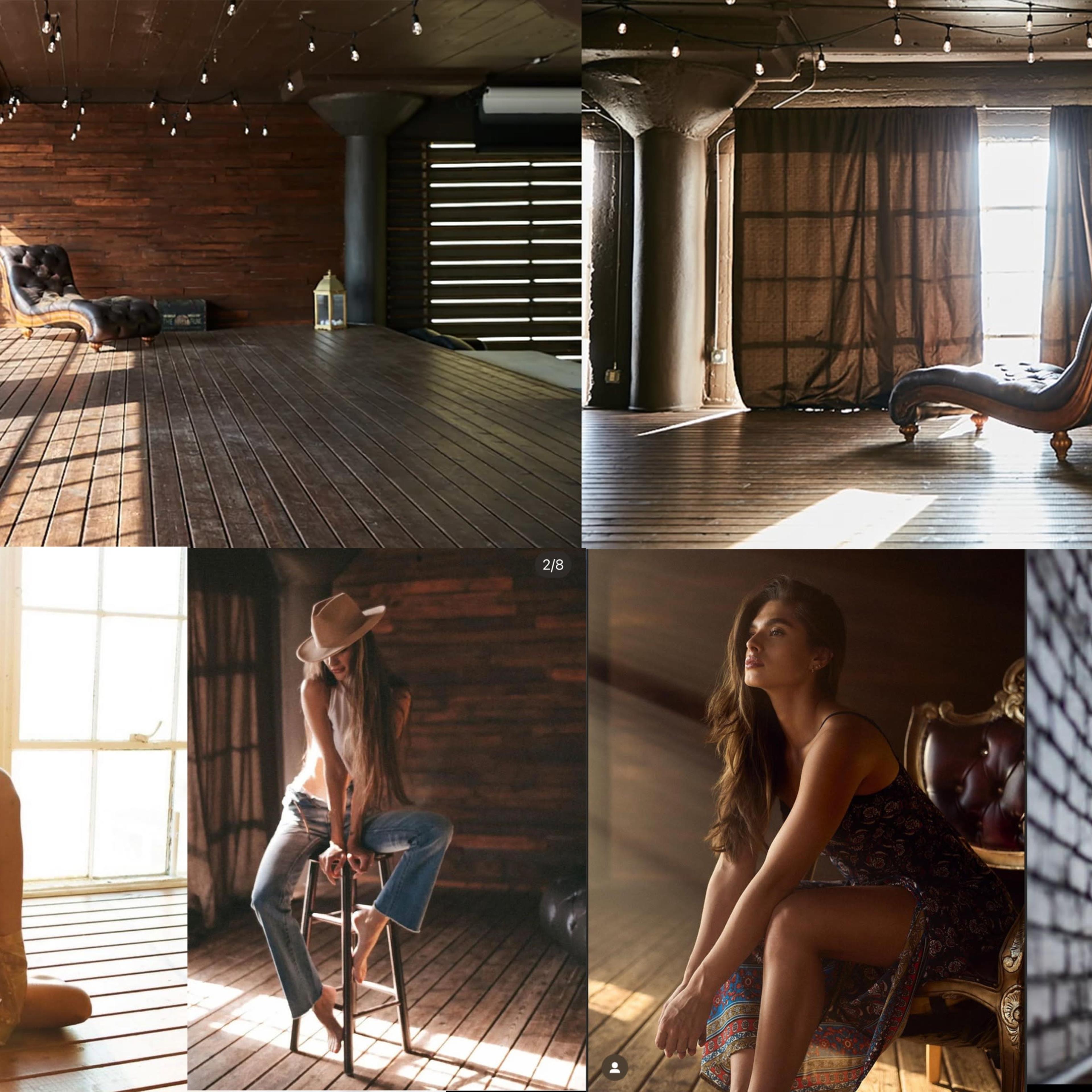 A spacious, well-lit studio featuring wooden walls and floor, with elegant furniture and models posed by large windows.