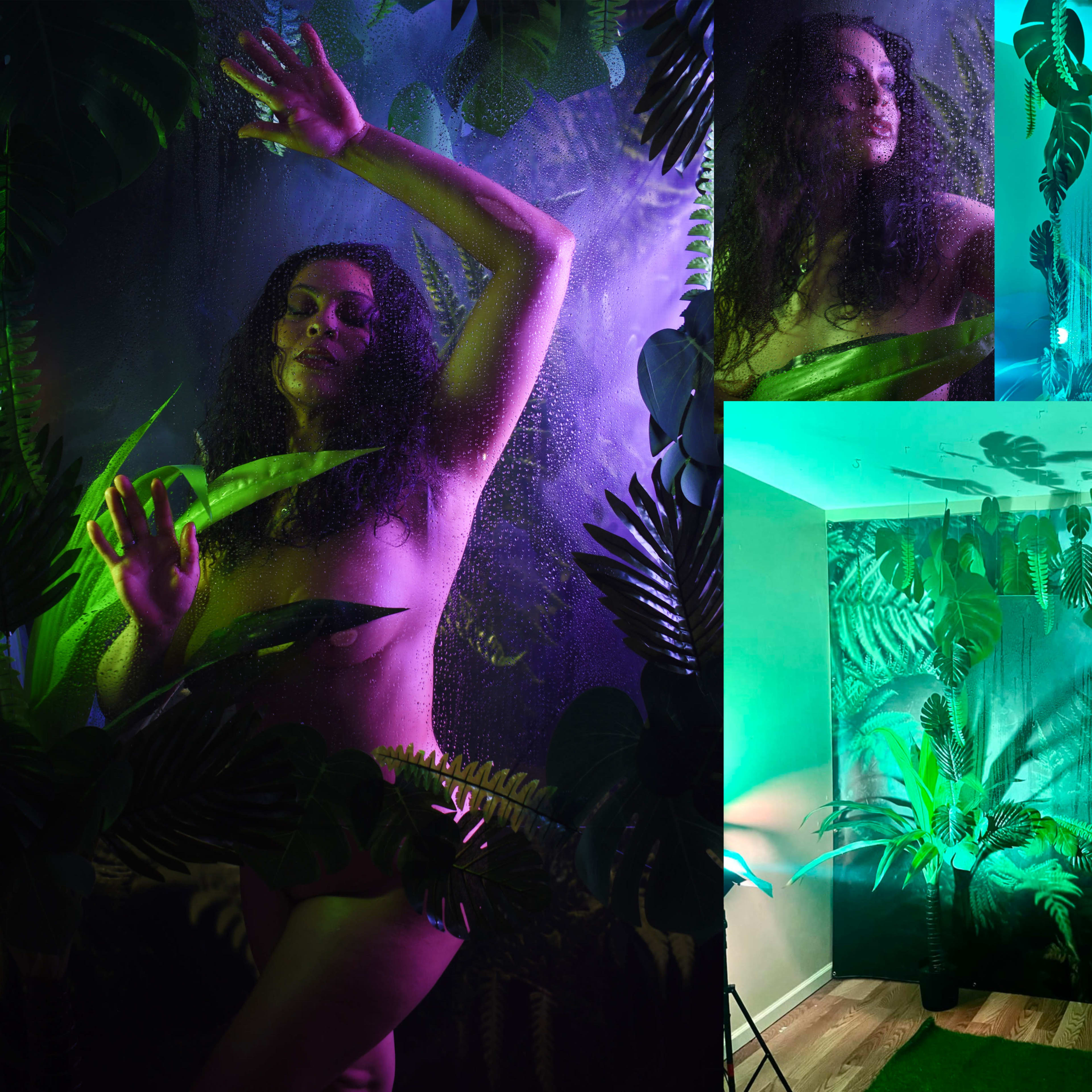 A woman posed among vibrant green foliage with colorful lighting, surrounded by a misty atmosphere.