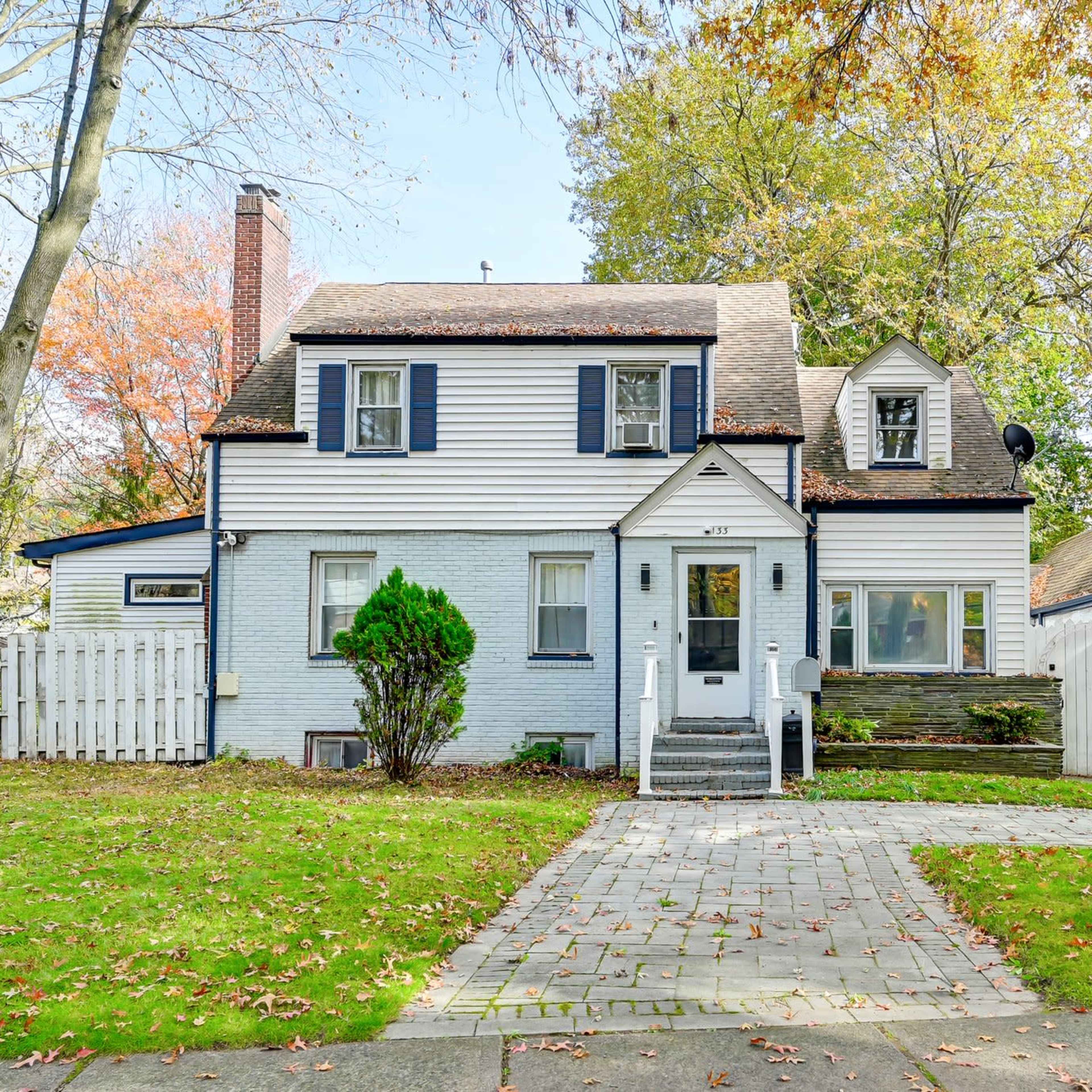 Modern Open Concept Entire single family home with basketball court and full deck in the back yard. Small creek runs as well on side of property. Image in Englewood, Englewood, NJ