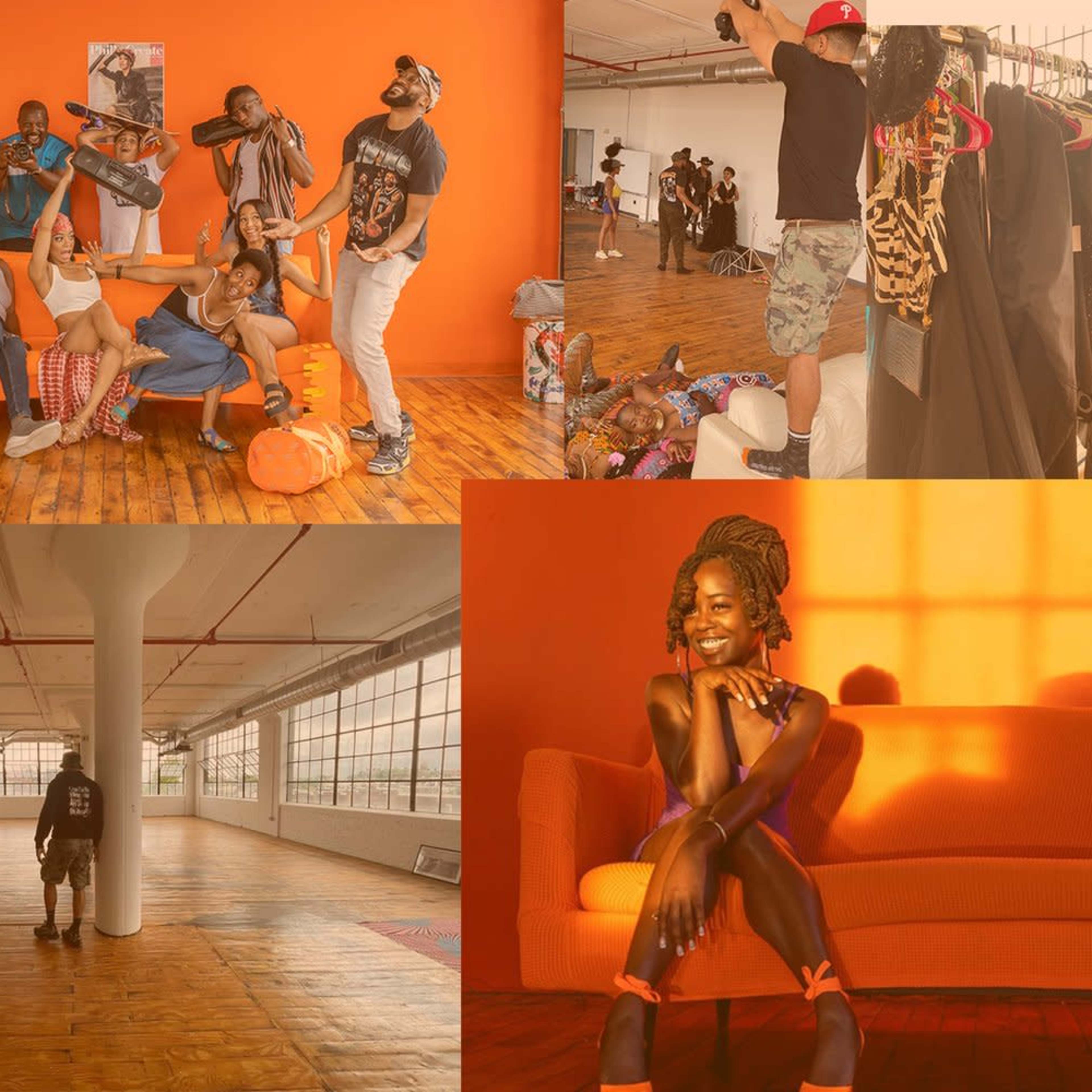 A vibrant studio space with models posing in eclectic outfits, clothing racks displaying various garments, and warm, natural light streaming through large windows.