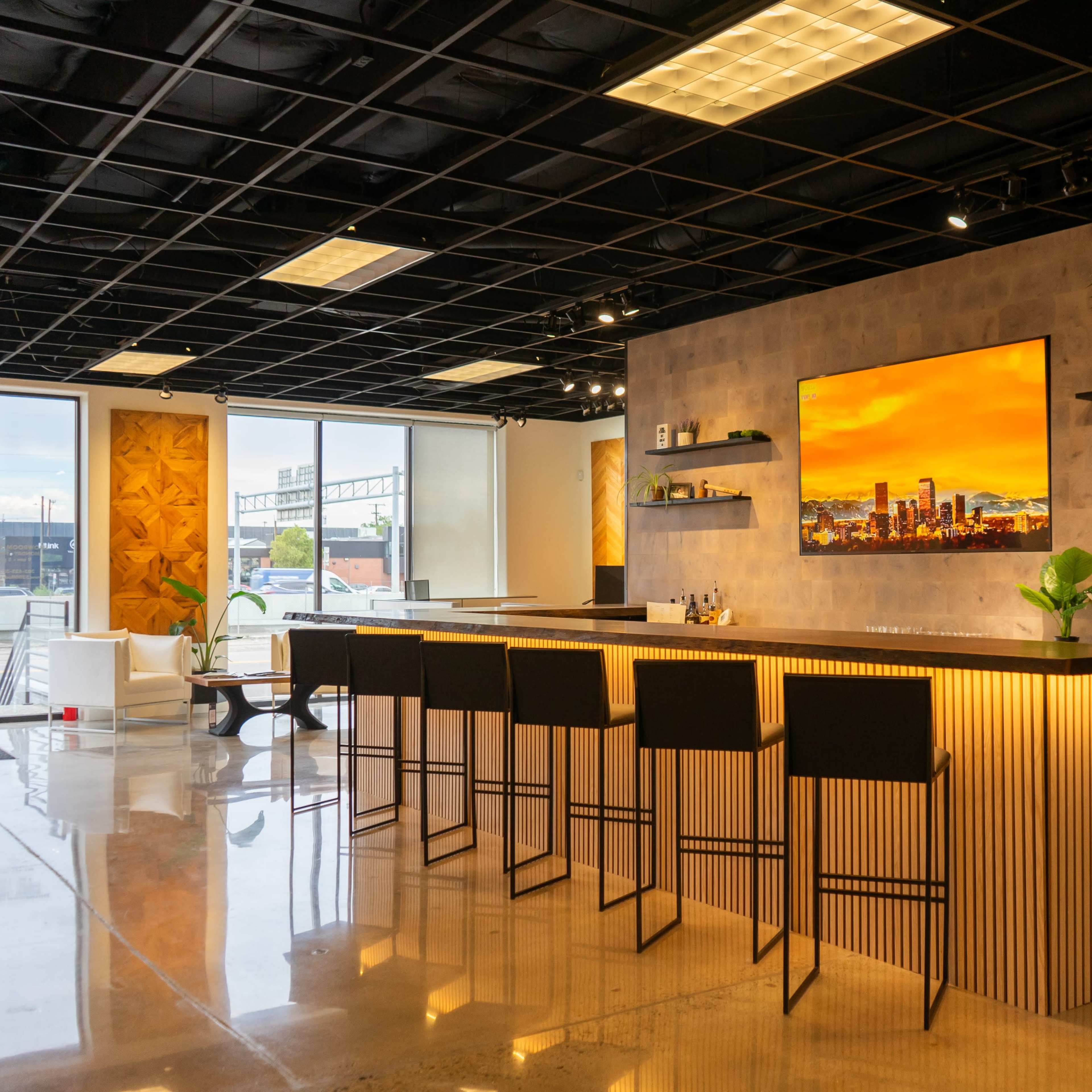 Modern & Spacious Event Space -Urban flooring gallery space with a bar, entertainment patio, and golf simulator. Image in Central, Denver, CO