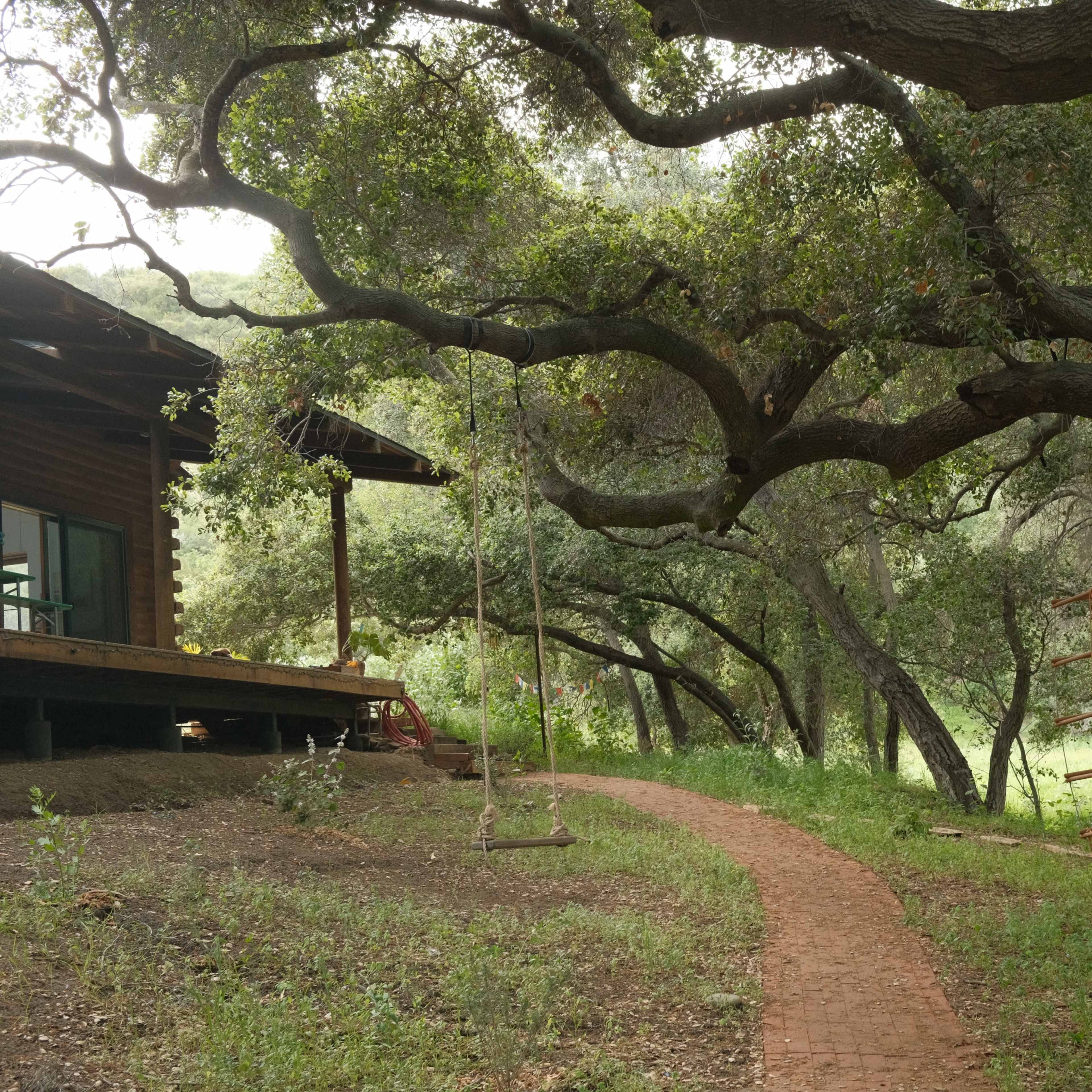 Log cabin house, large open field, oak grove Image in Topanga, Los Angeles County, CA