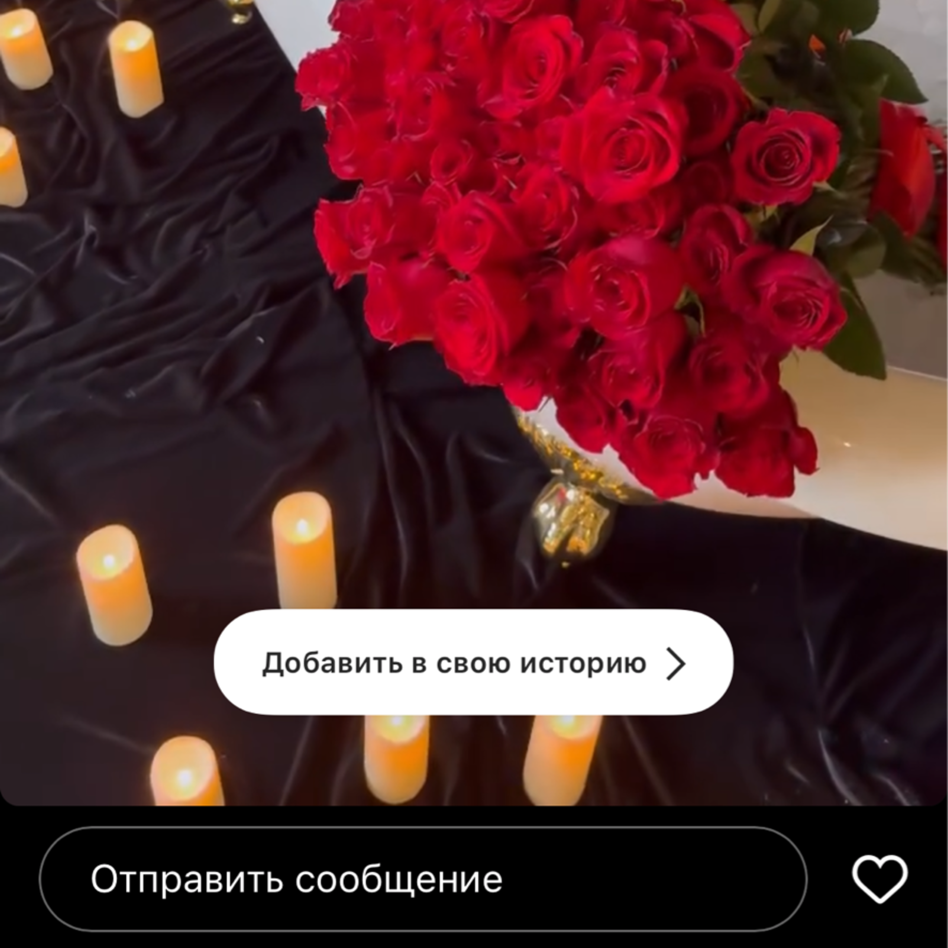 A bathtub filled with water is surrounded by large bouquets of red roses, champagne bottles, and lit candles on a dark surface in Chicago, Illinois.