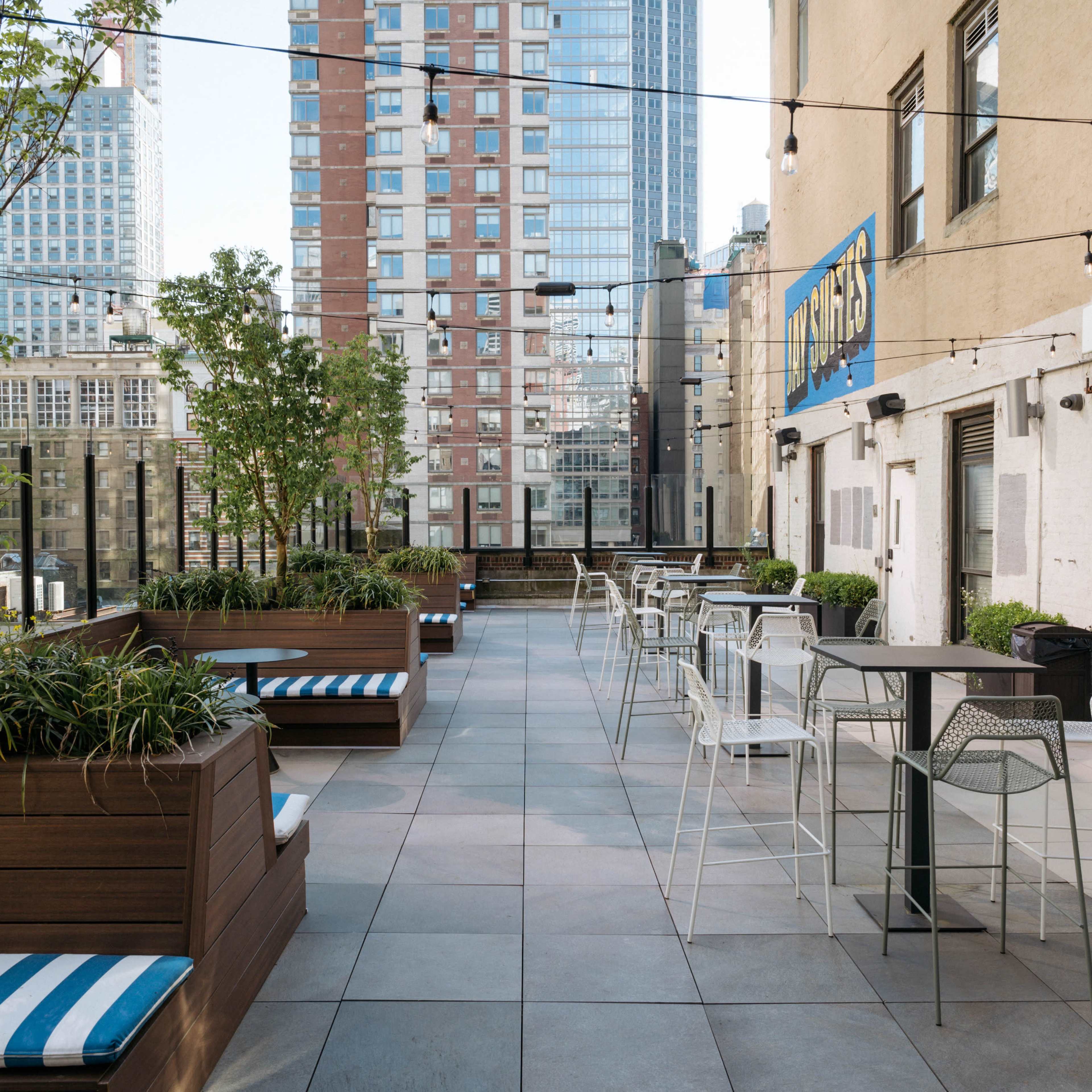 Amazing 2,000 SF Rooftop Terrace in Midtown Overlooking the Empire State Building with Sound System, Seating & Displays - Easy Access from Penn Station - NEW for 2025 Image in Midtown, New York, NY