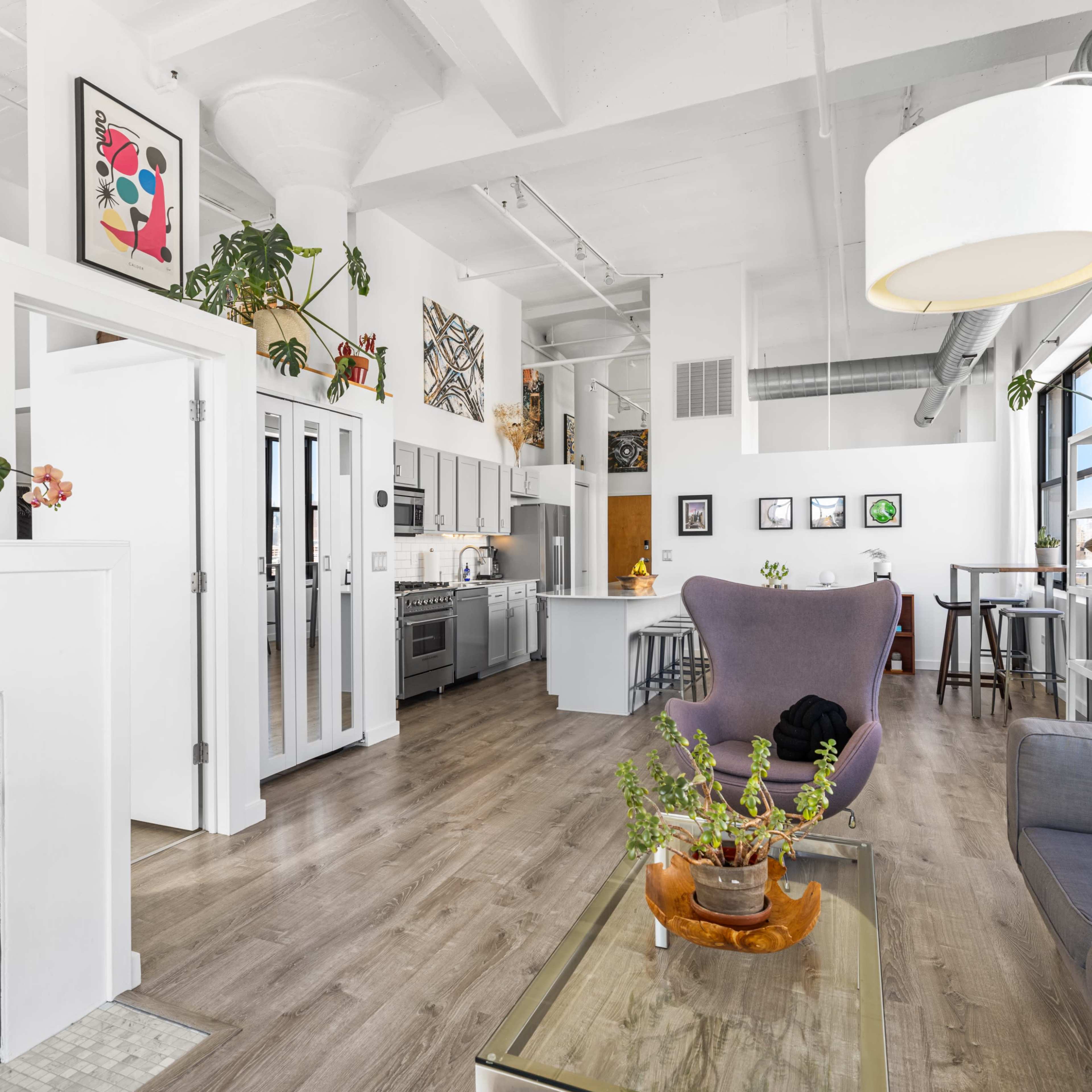Modern & Historic Loft w/ 20ft Ceilings, South+East Facing Windows, Skyline Views, and Private Balcony Image in Near West Side, Chicago, IL