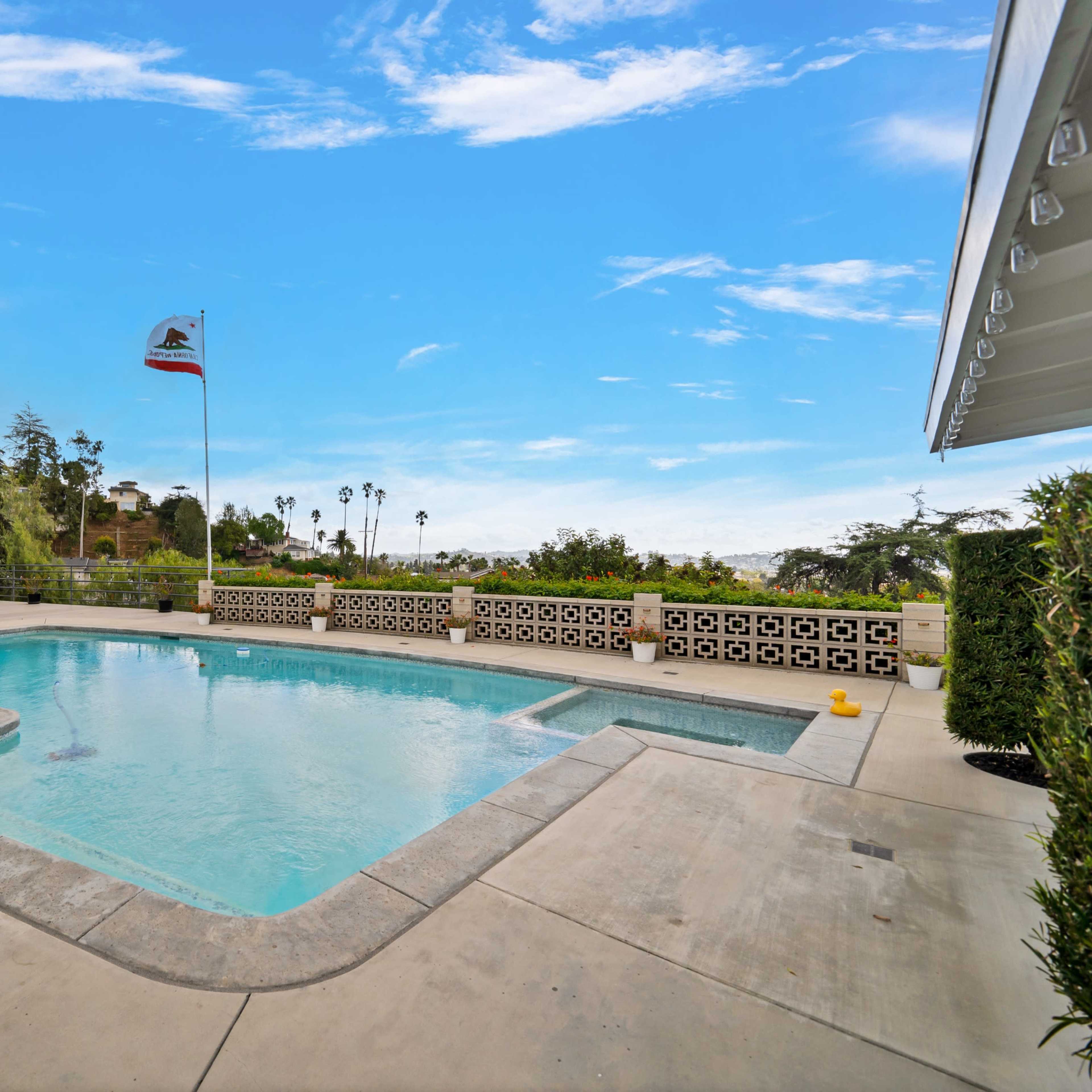 Features a variety of scenes including a panoramic view of the Los Angeles skyline, the word "California" in a vintage font, glass decor arranged on shelves, a swimming pool surrounded by greenery, and a spacious interior with a stone fireplace.