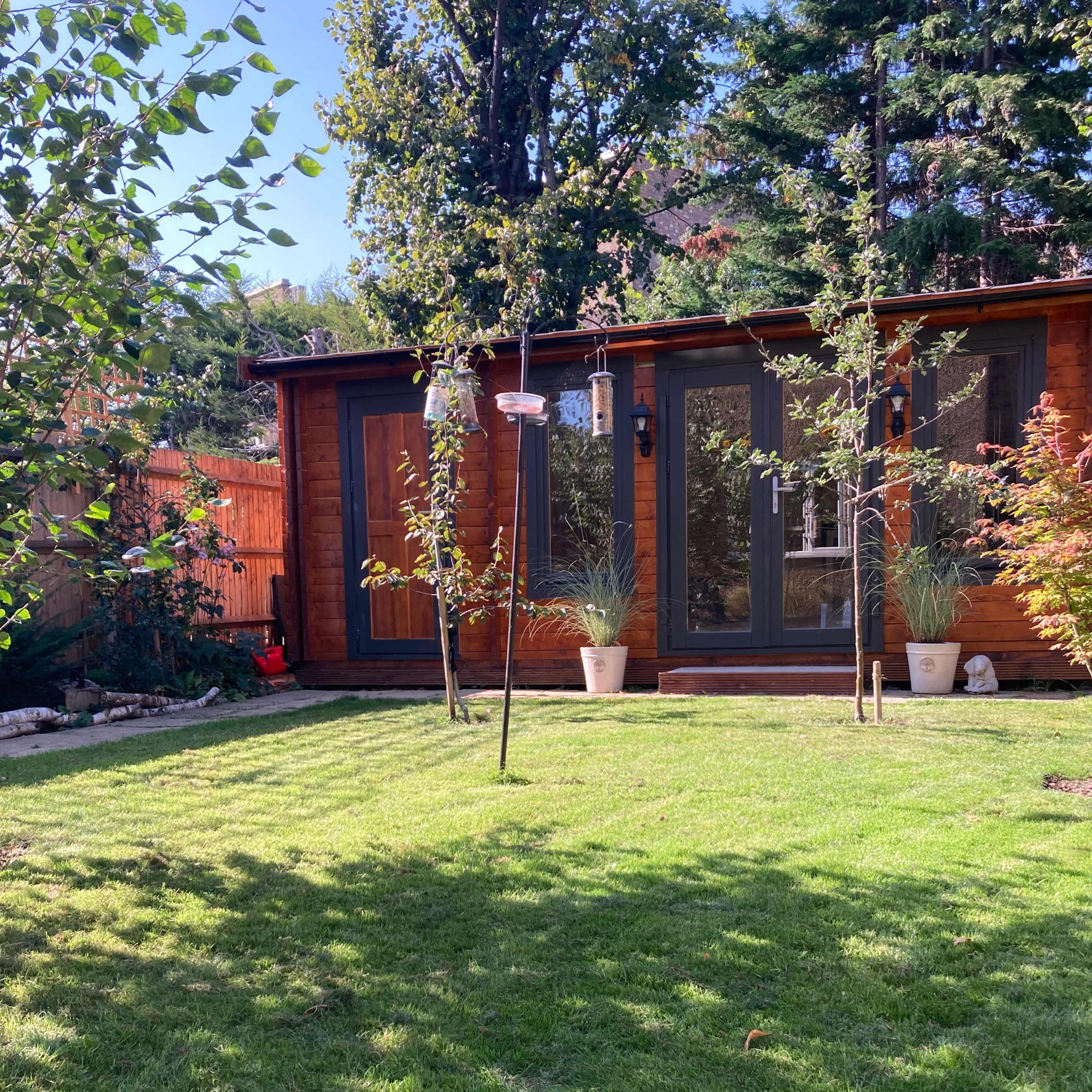 light-filled log cabin with ensuite bathroom Image in Raynes Park, London, England