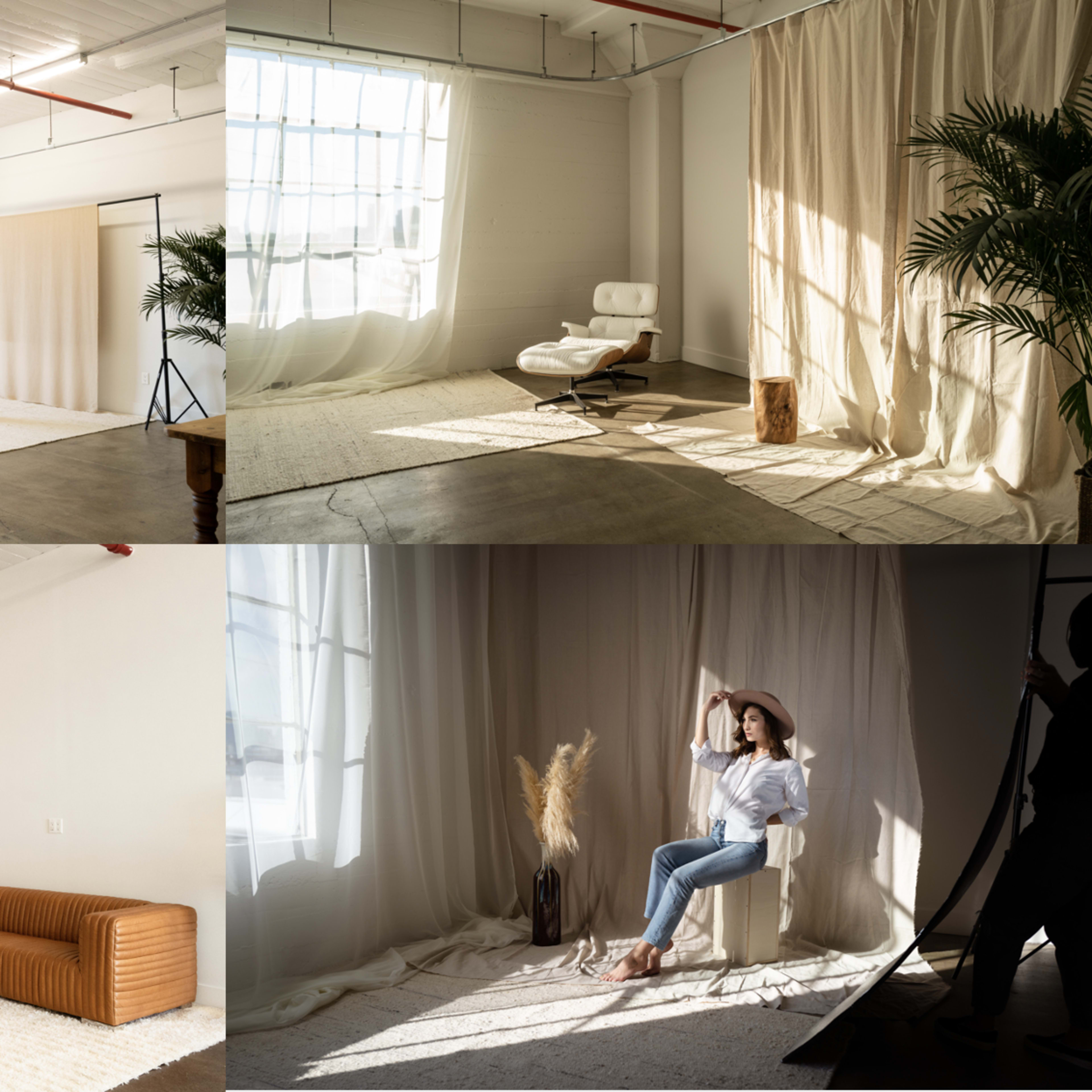 A bright, multi-functional studio space featuring various areas with natural lighting, decorative elements, and seating arrangements.