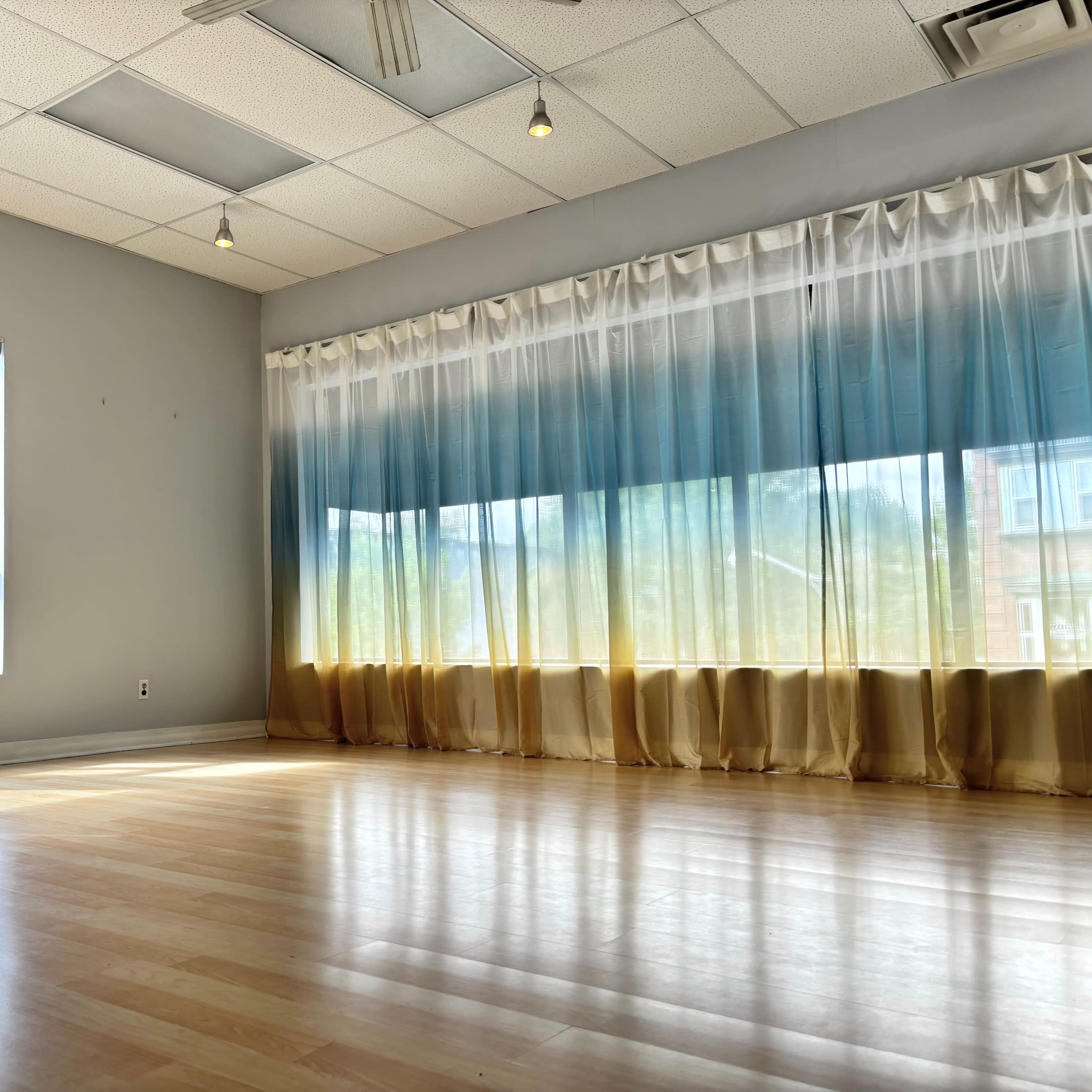 Sunny Dance & Yoga Studio with Ombré Curtains | Natural Light Haven Image in Harbord Village, Toronto, ON