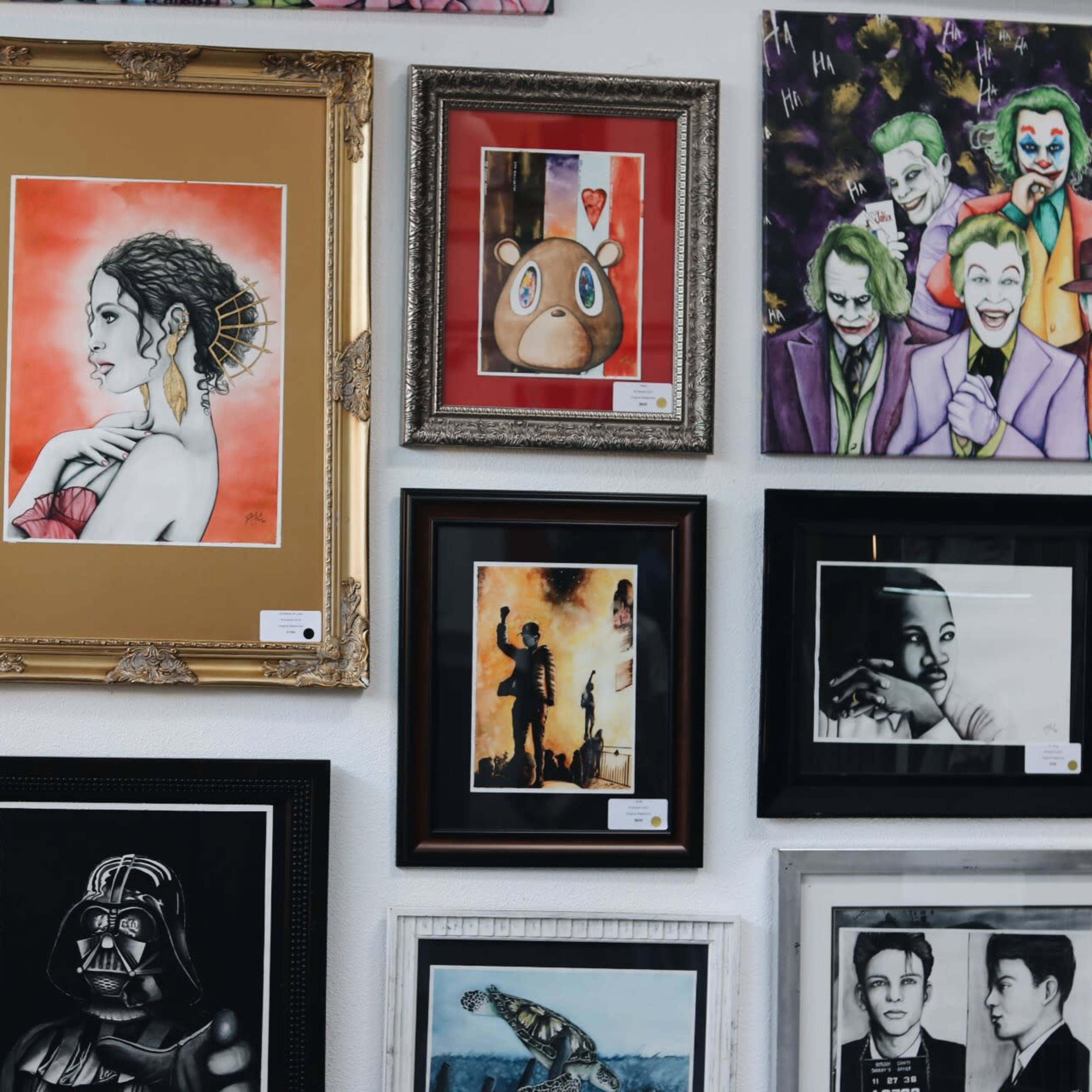 A vibrant art gallery featuring colorful murals and art pieces illuminated by neon signs and ambient lighting.