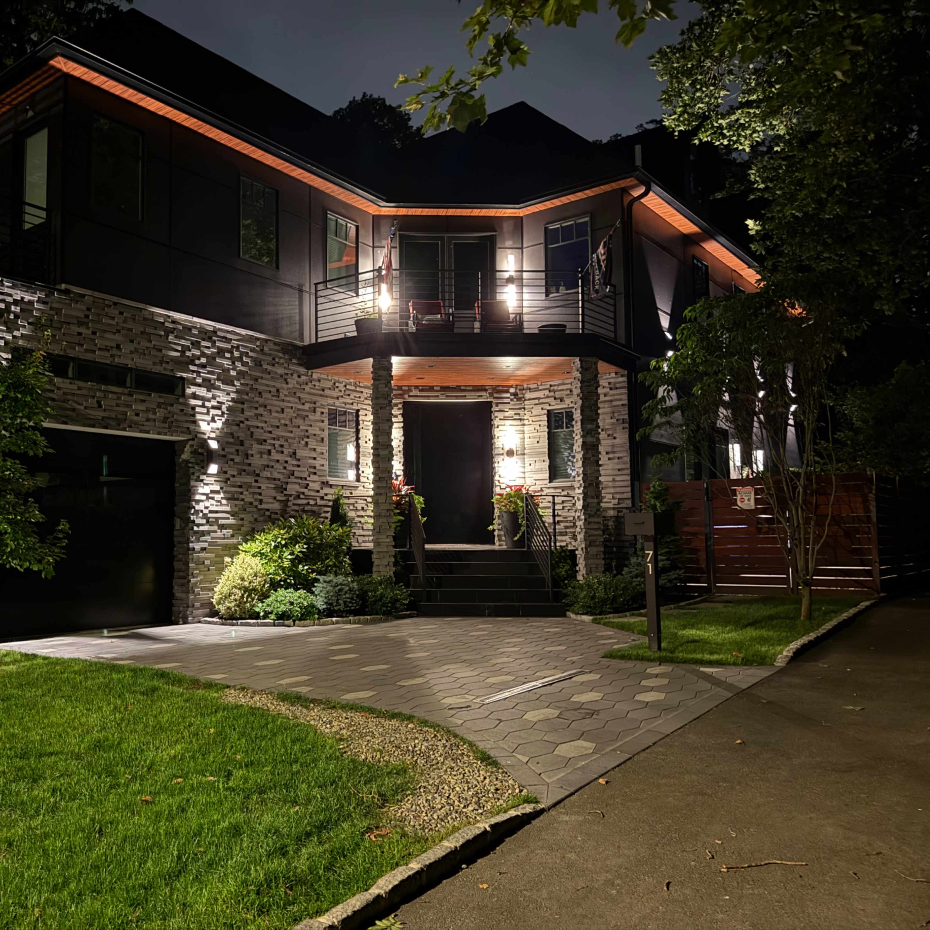 Modern Black Mansion | Dramatic Night Lighting & Luxury Film Location Image in Shore Acres, Richmond County, NY