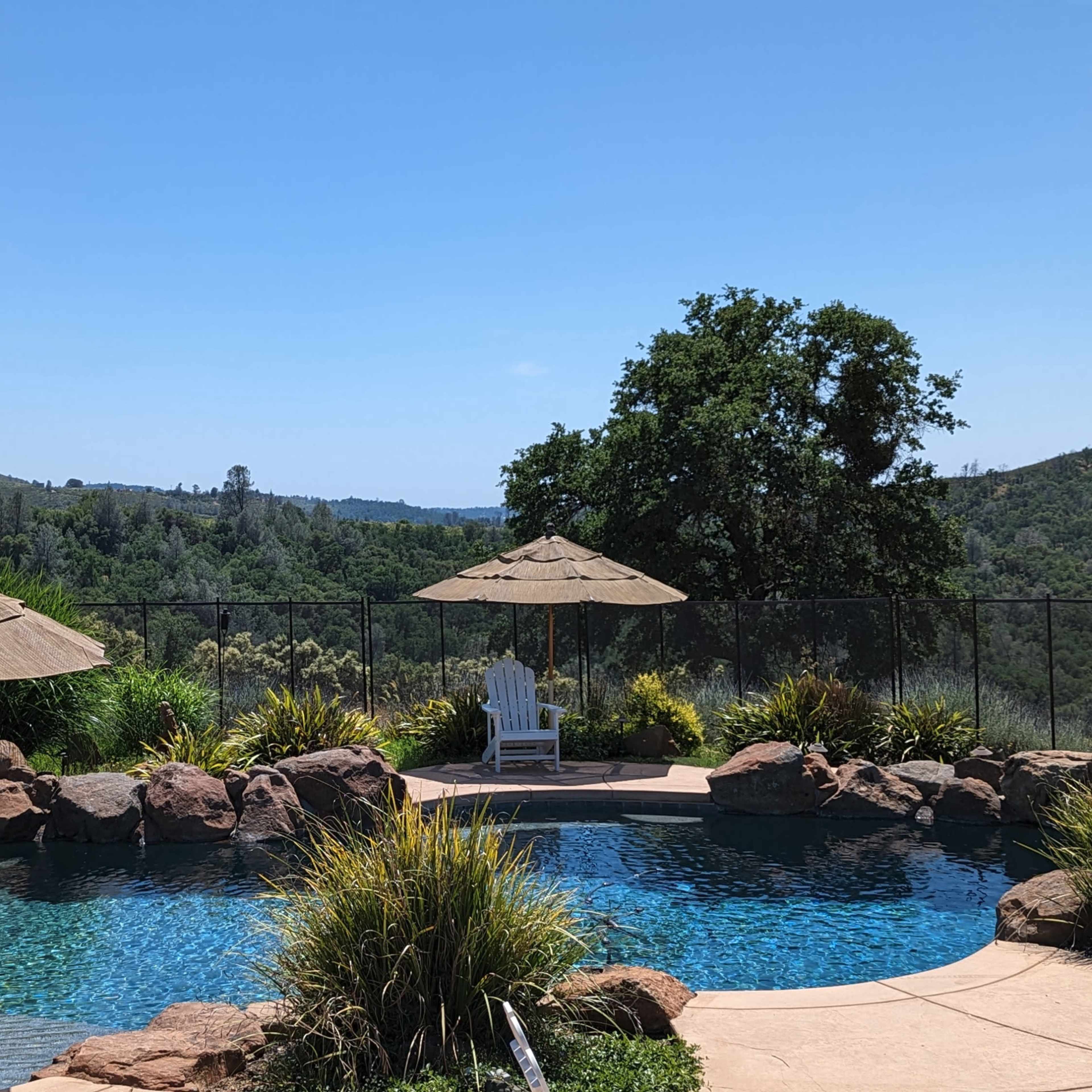 Upscale Pool with Waterfall in Secluded Hilltop Estate with Views Image in , Pilot Hill, CA