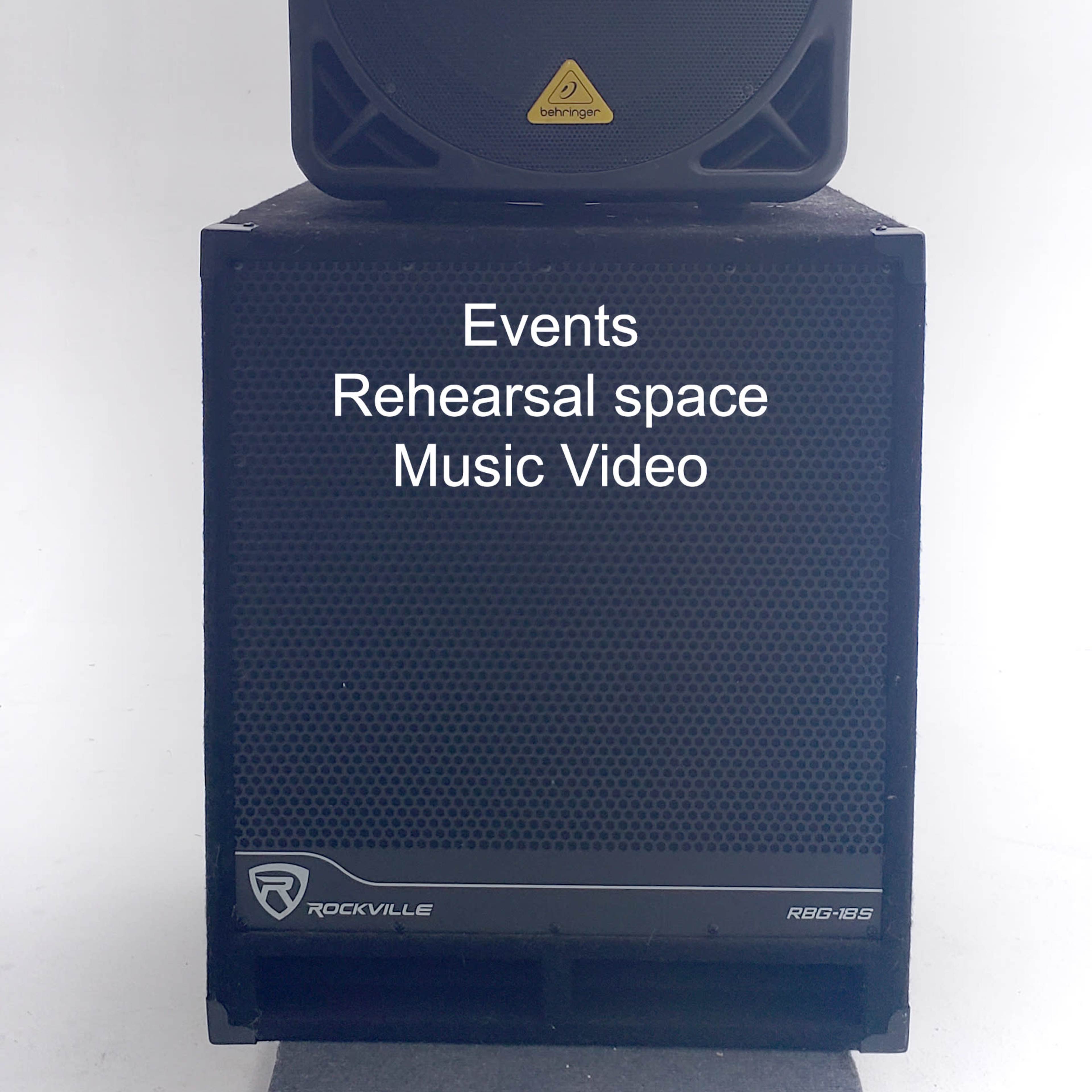 A speaker setup featuring an 18-inch subwoofer and a 15-inch Bluetooth speaker on top, designed for events and music videos.