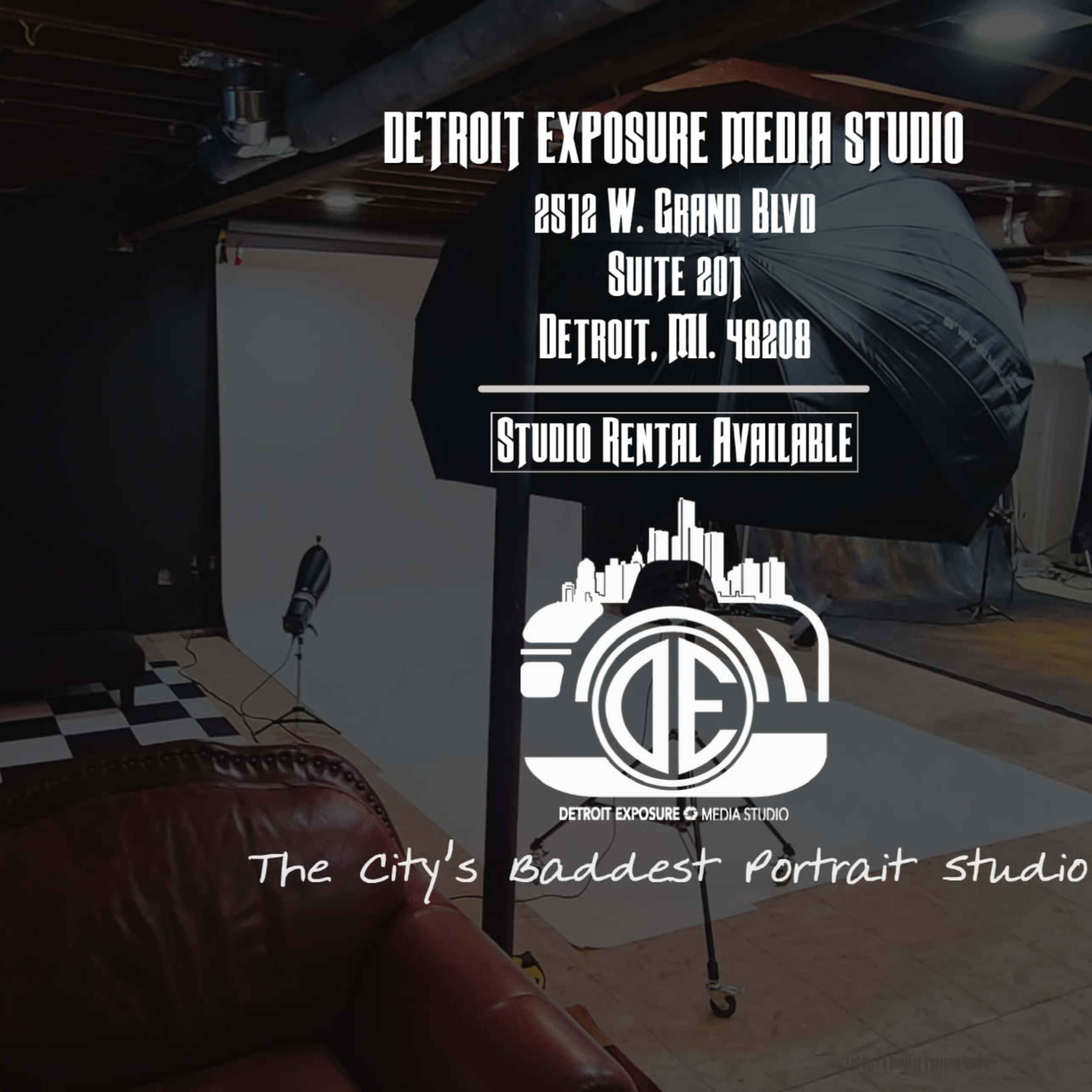 A photography studio setup with various lighting equipment, backdrops, and a checkered floor.