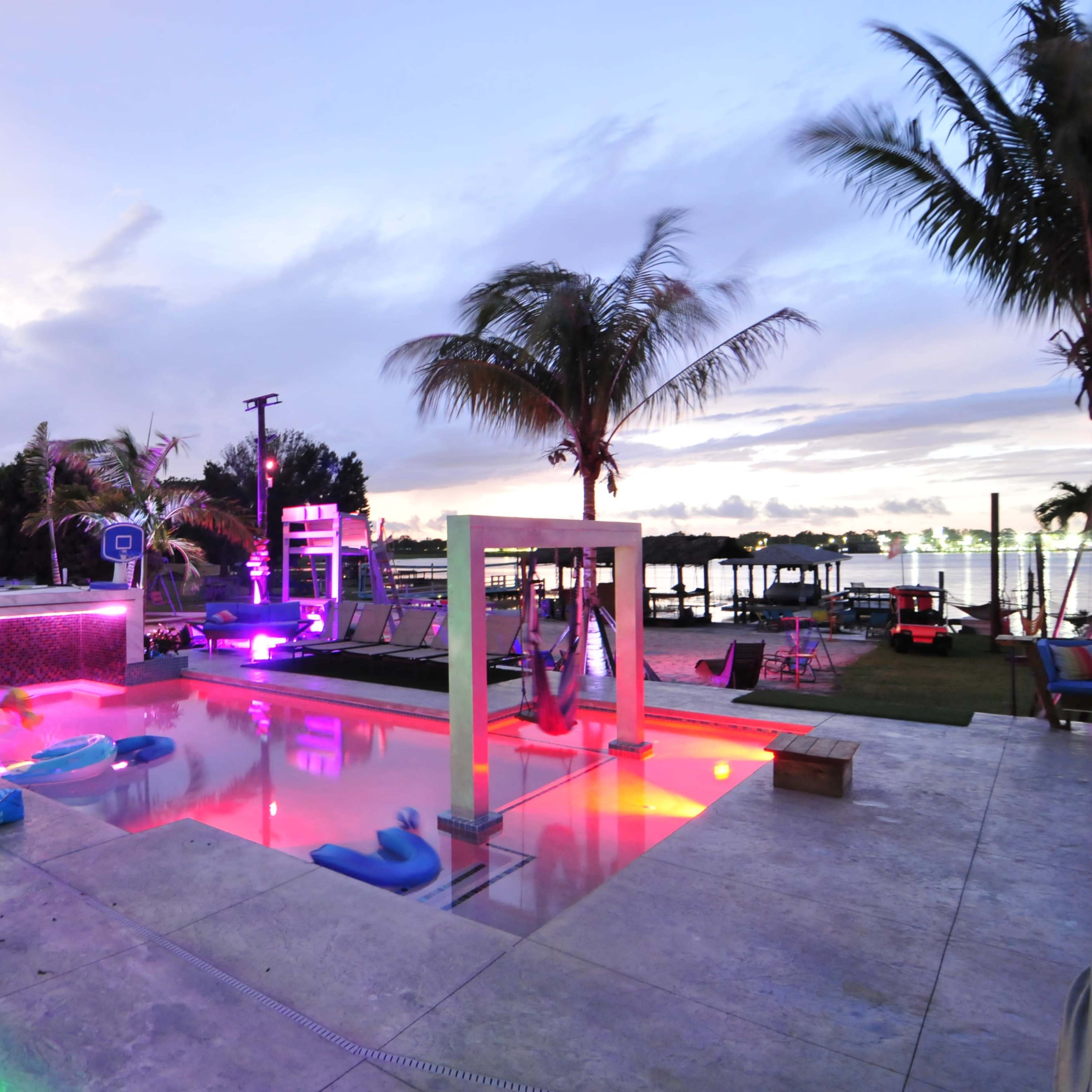 Lakefront grotto Palm Oasis, Sand Volleyball, and Custom Pool Features Image in , Orlando, FL