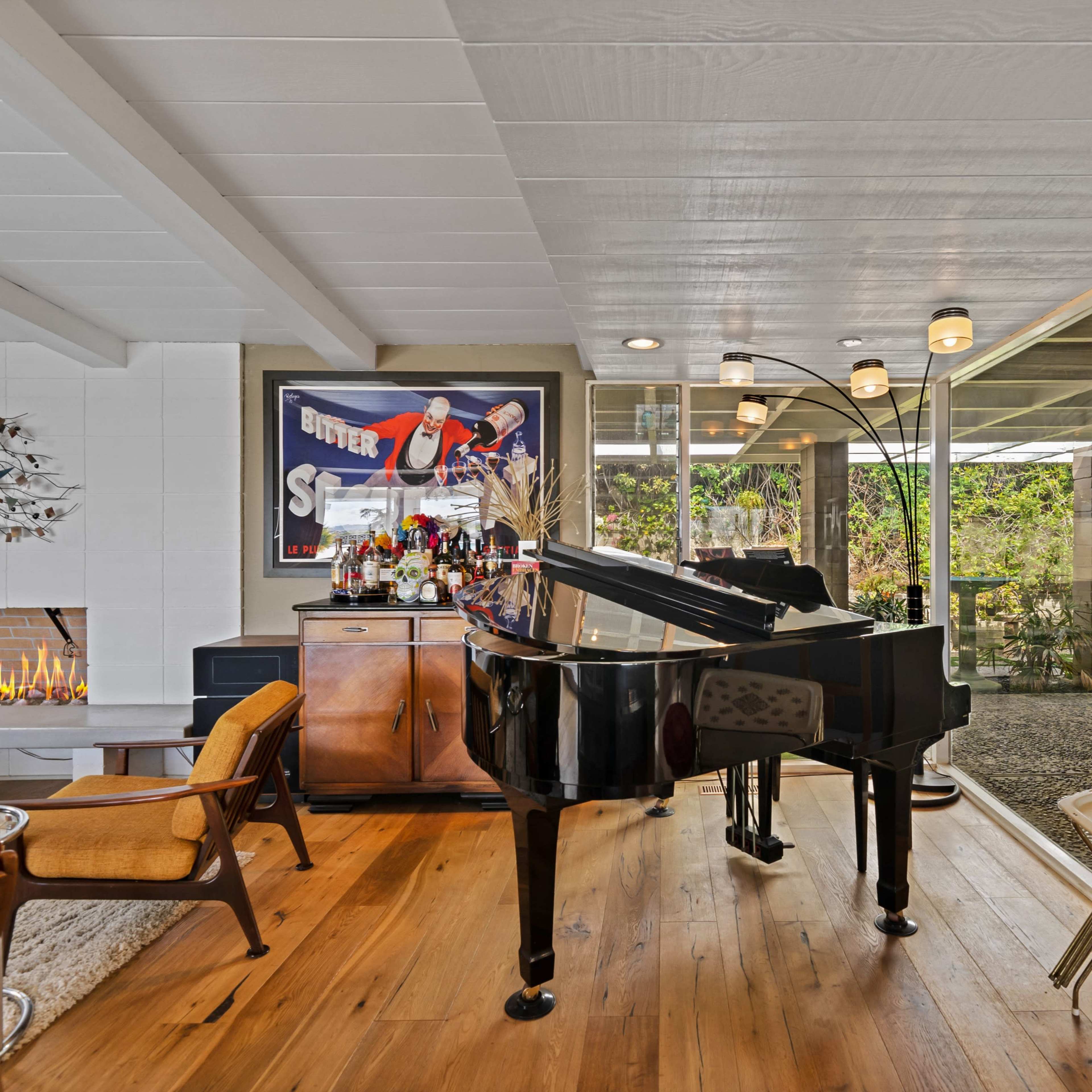 Features a variety of scenes including a panoramic view of the Los Angeles skyline, the word "California" in a vintage font, glass decor arranged on shelves, a swimming pool surrounded by greenery, and a spacious interior with a stone fireplace.