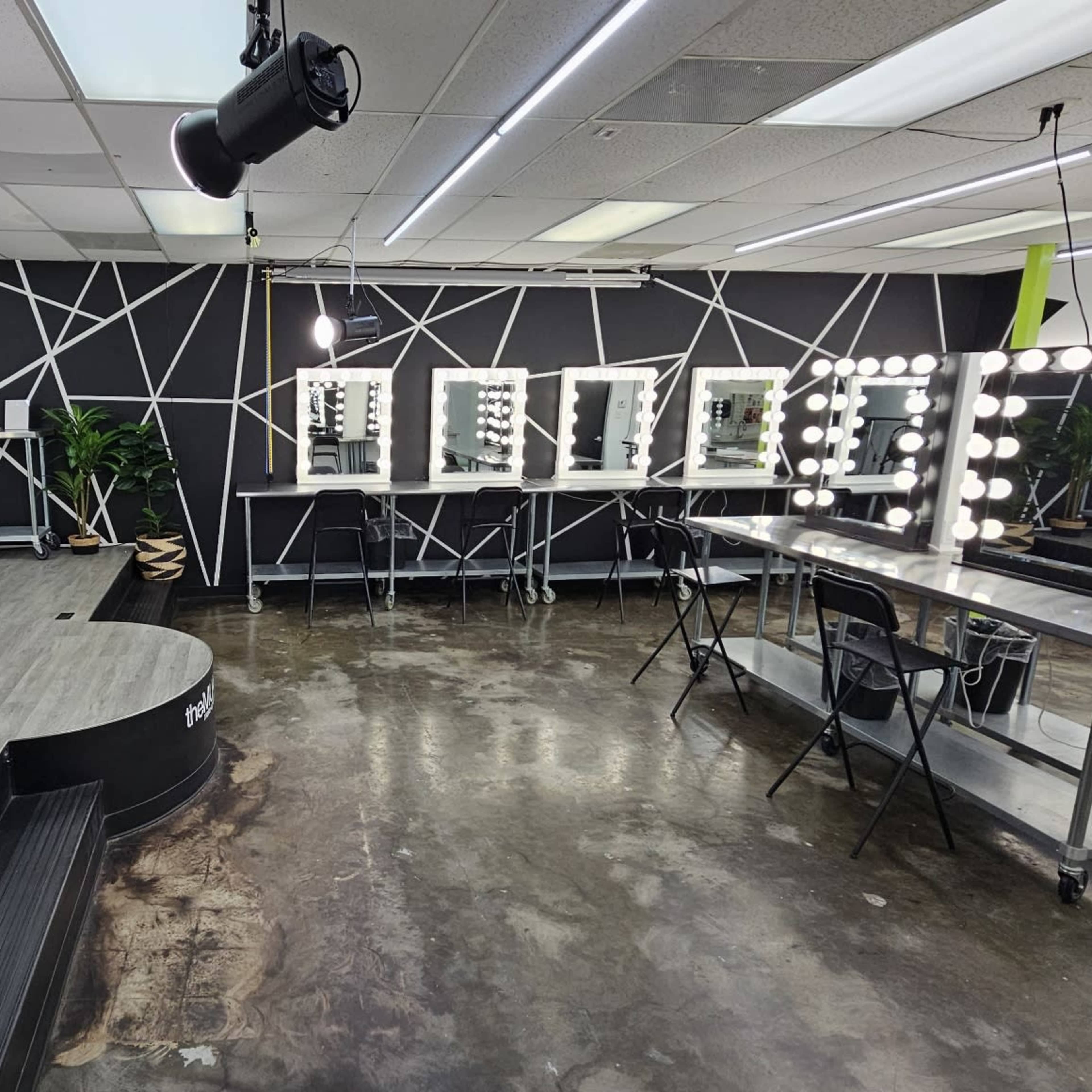 Clean, bright, open studio or classroom with Hollywood Vanities and barstool chairs Image in Westside, Houston, TX