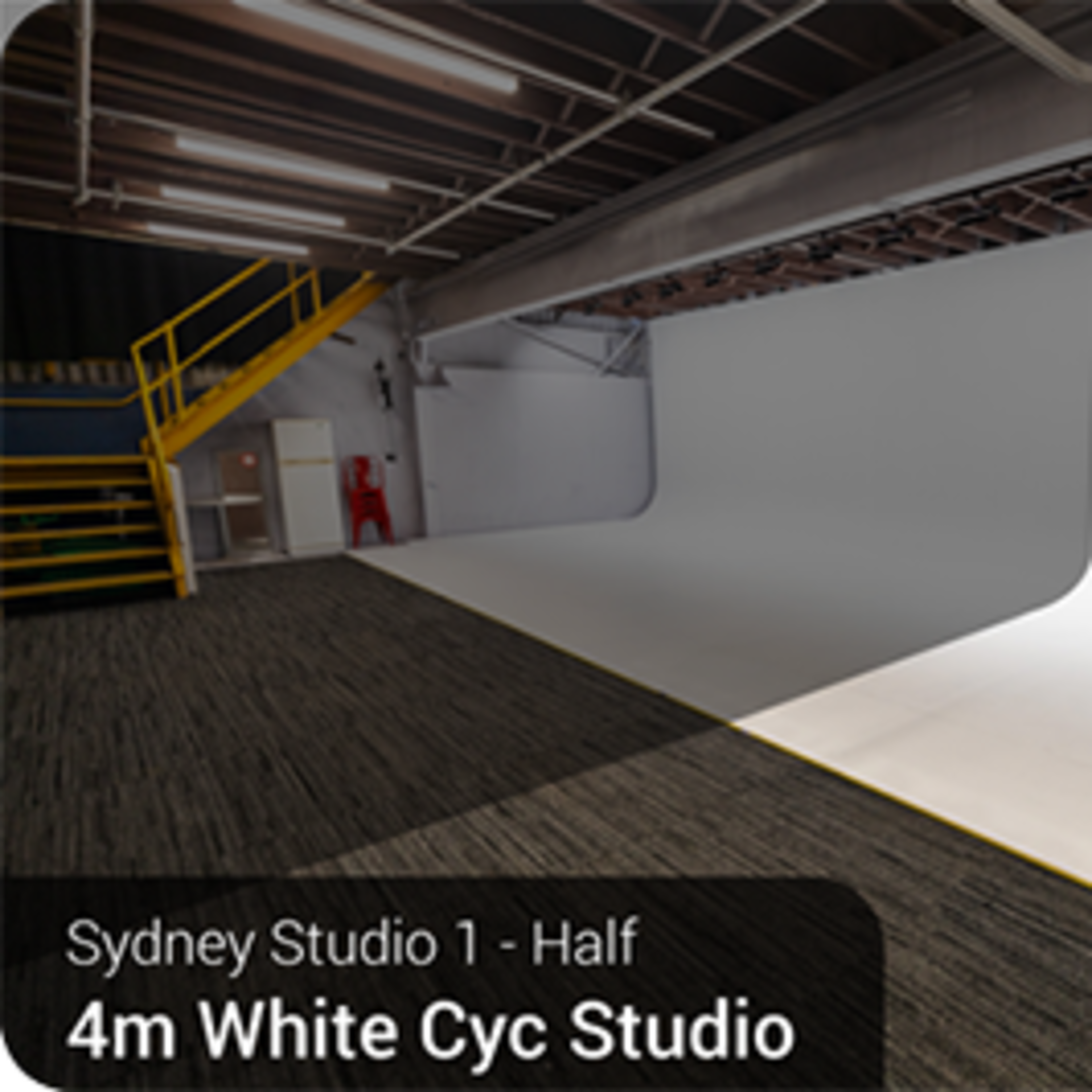 A half section of a 4-meter white cyclorama studio in Sydney, featuring a clean, expansive backdrop and a polished floor.