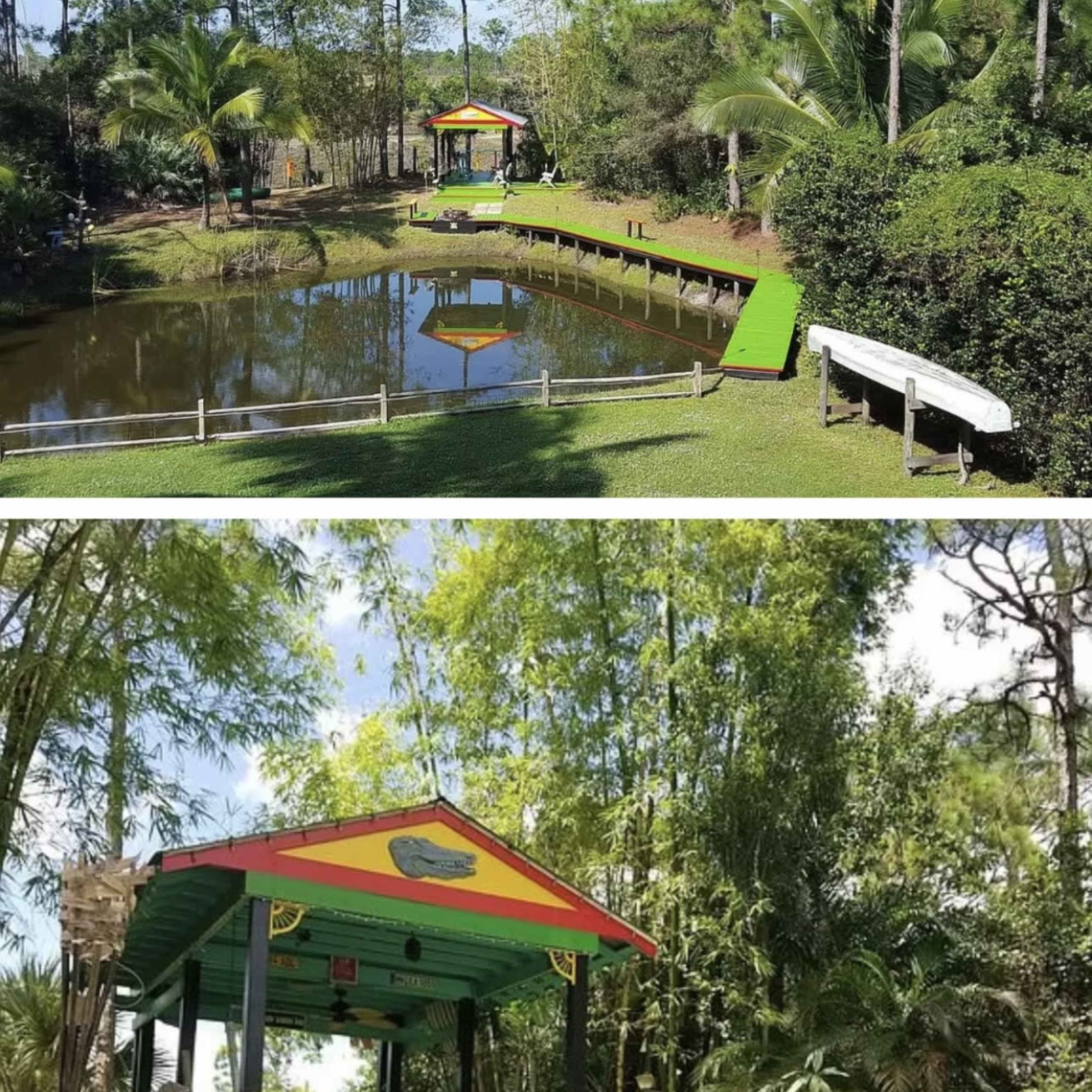 A tranquil pond surrounded by greenery, featuring a colorful dock and a canoe on the water's edge.