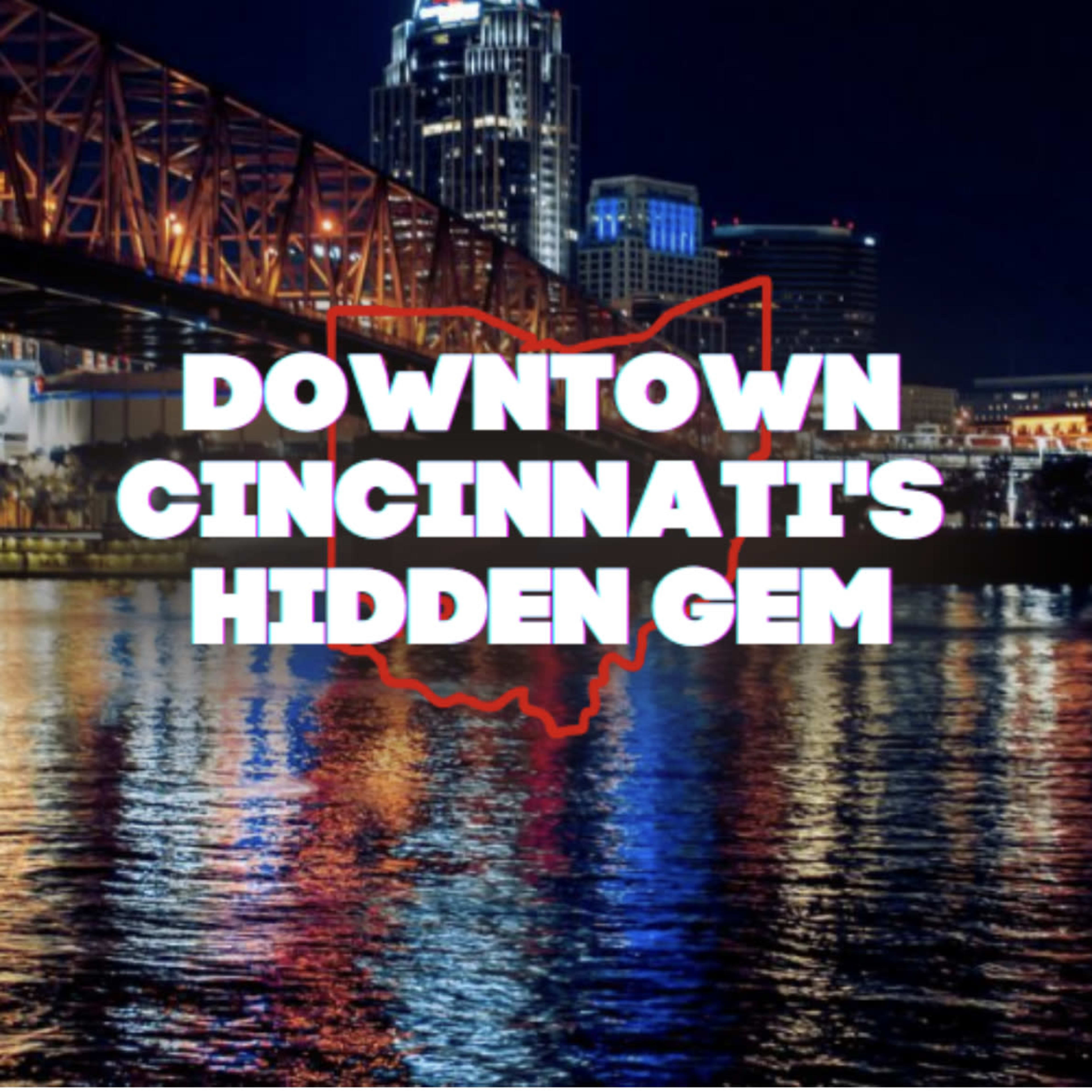A nighttime view of downtown Cincinnati with illuminated buildings reflected in the water and a graphic outline of Ohio.