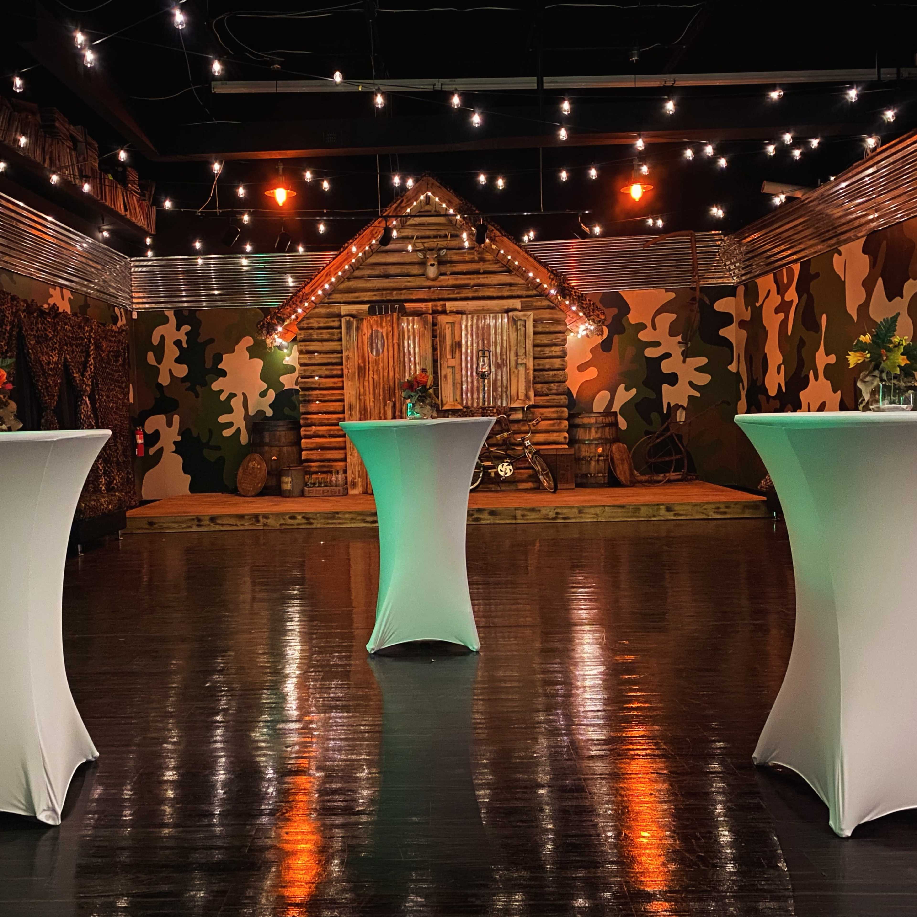 Indoor/Outdoor Ambience, prop log cabin with porch/stage, venue Image in Winston-Salem, Winston-Salem, NC