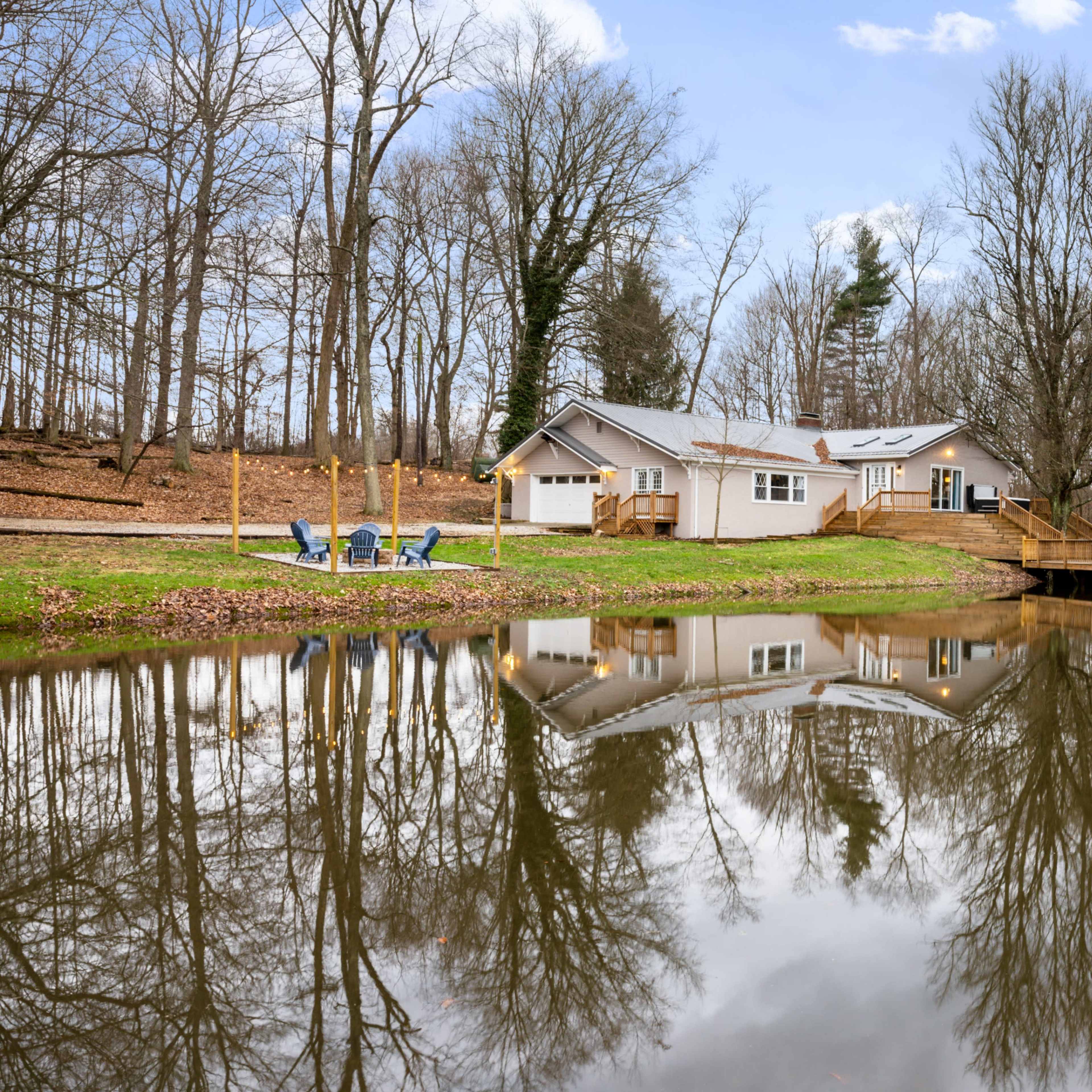 Private house on a pond with wooded 9 acres Image in Etna Township, Etna, OH