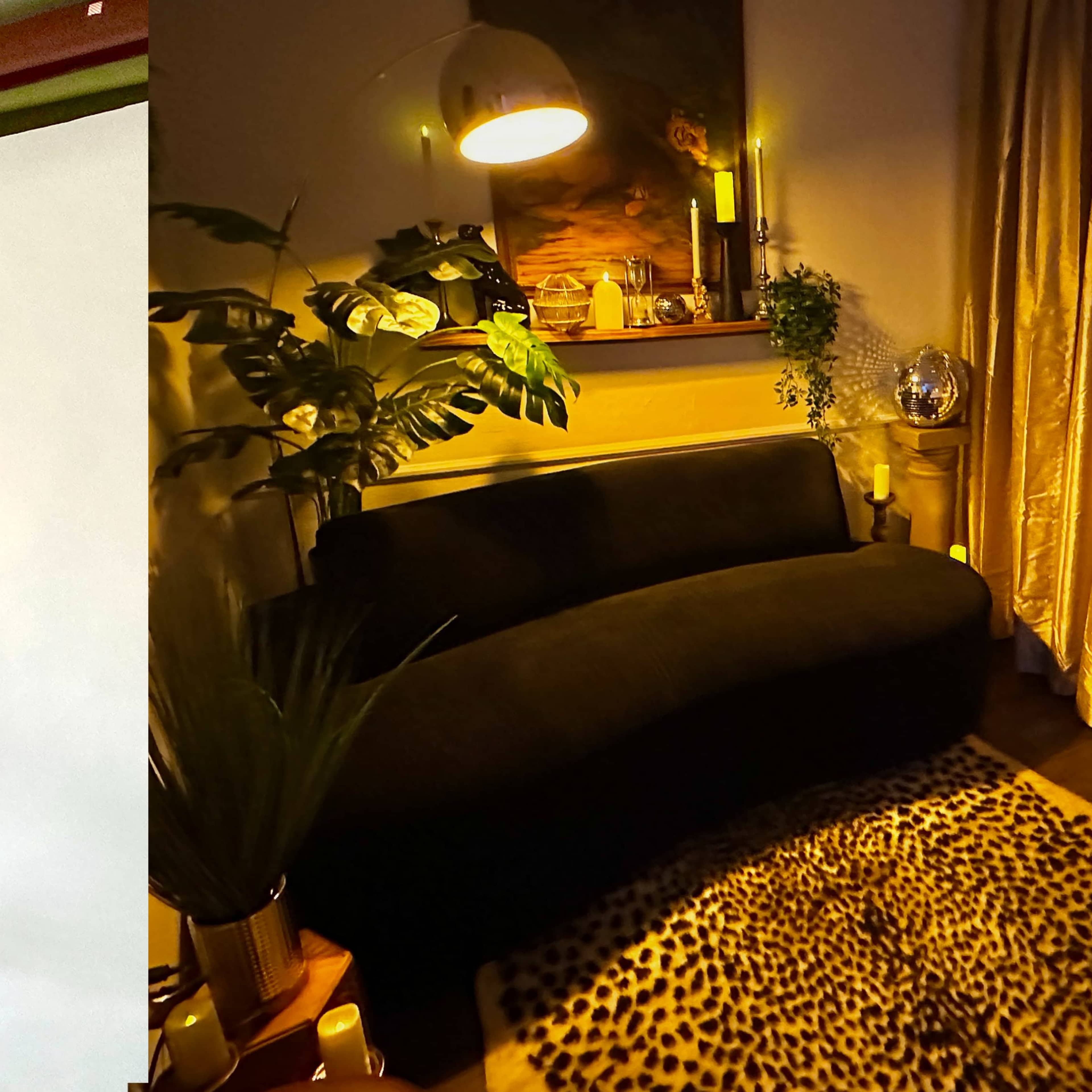 A photography studio with a blank backdrop and a stool on one side, and a cozy living room with a dark sofa and decorative plants on the other side.