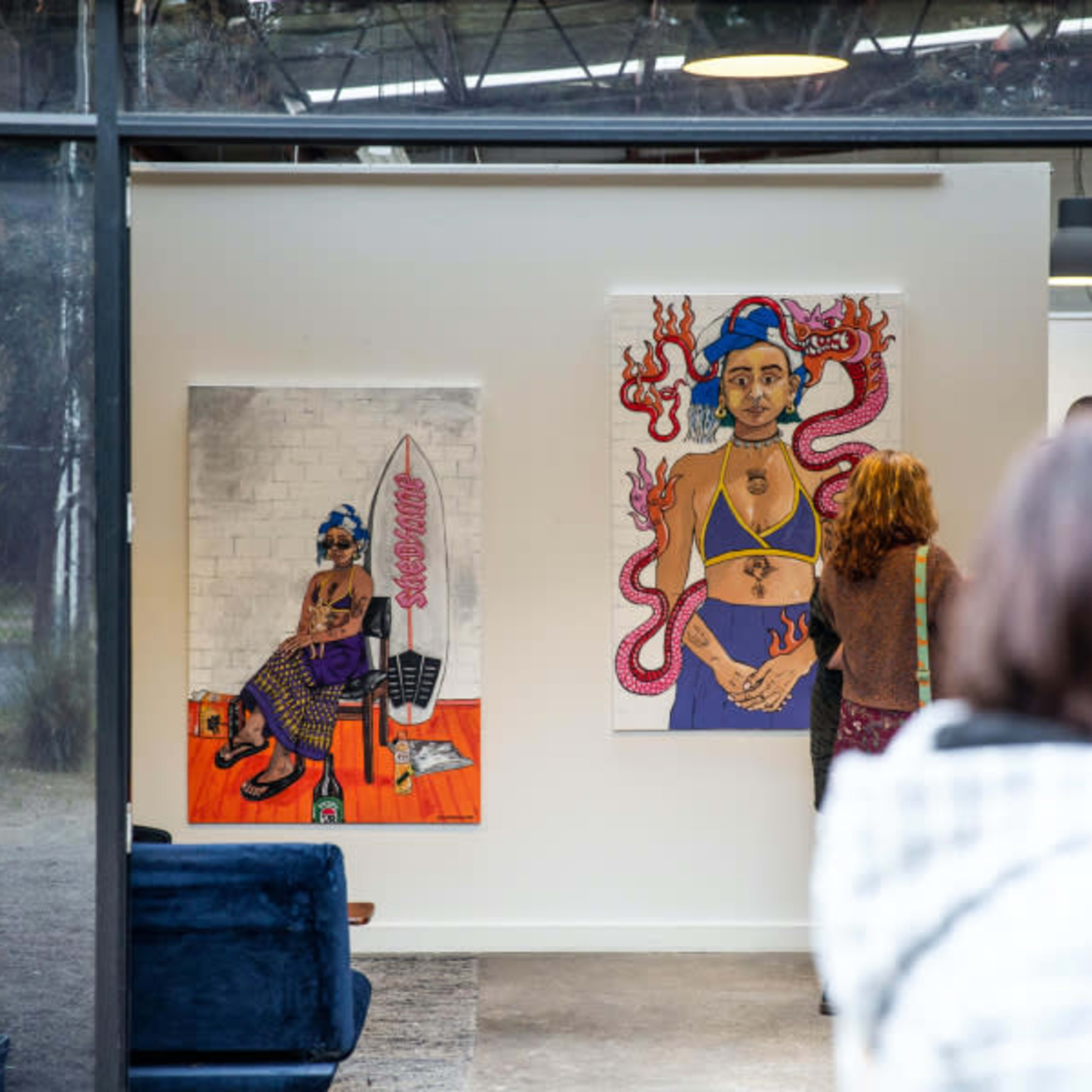 Two vibrant artworks displayed on a gallery wall, with visitors observing the pieces in a spacious, well-lit environment.