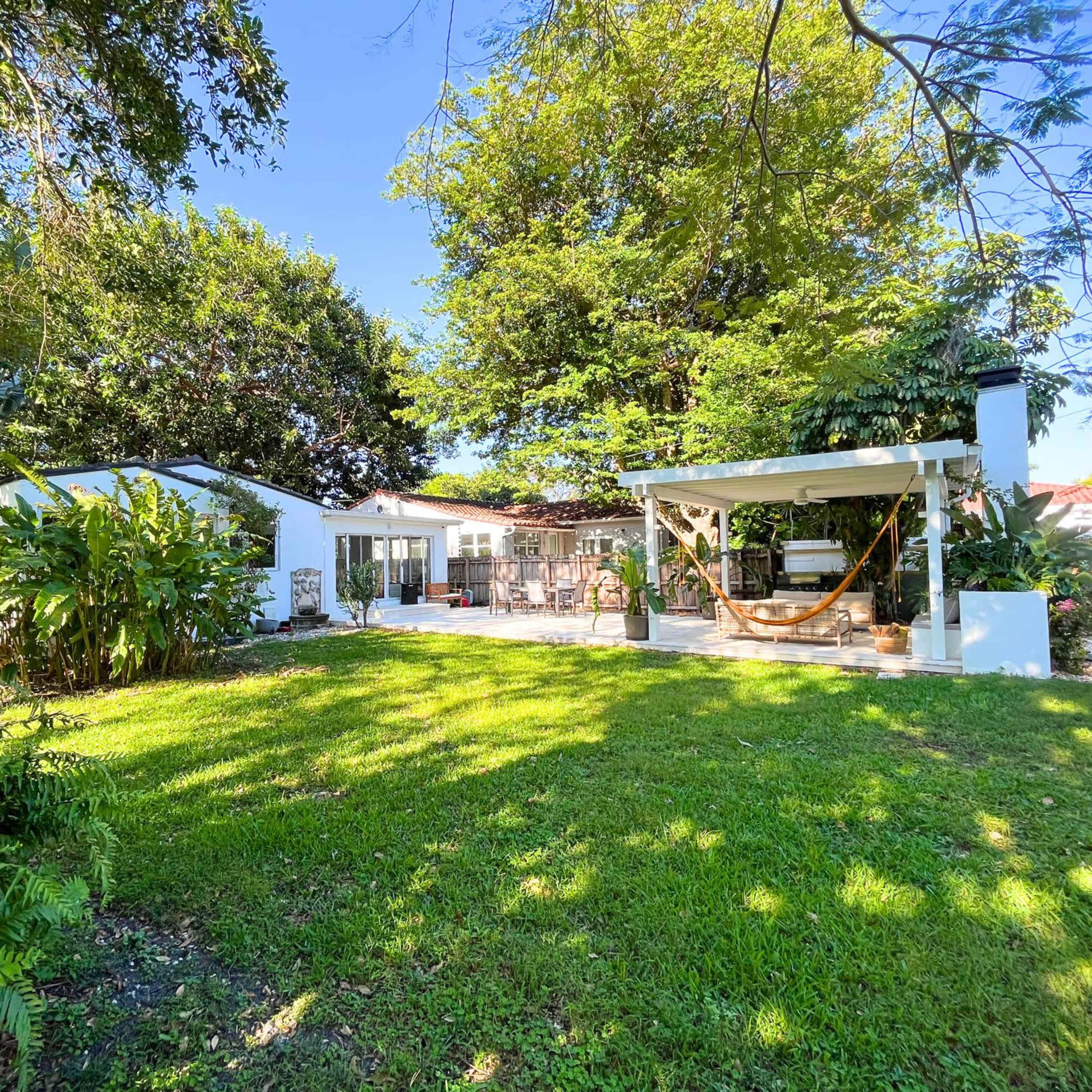 Lush, backyard space Image in El Portal, El Portal, FL