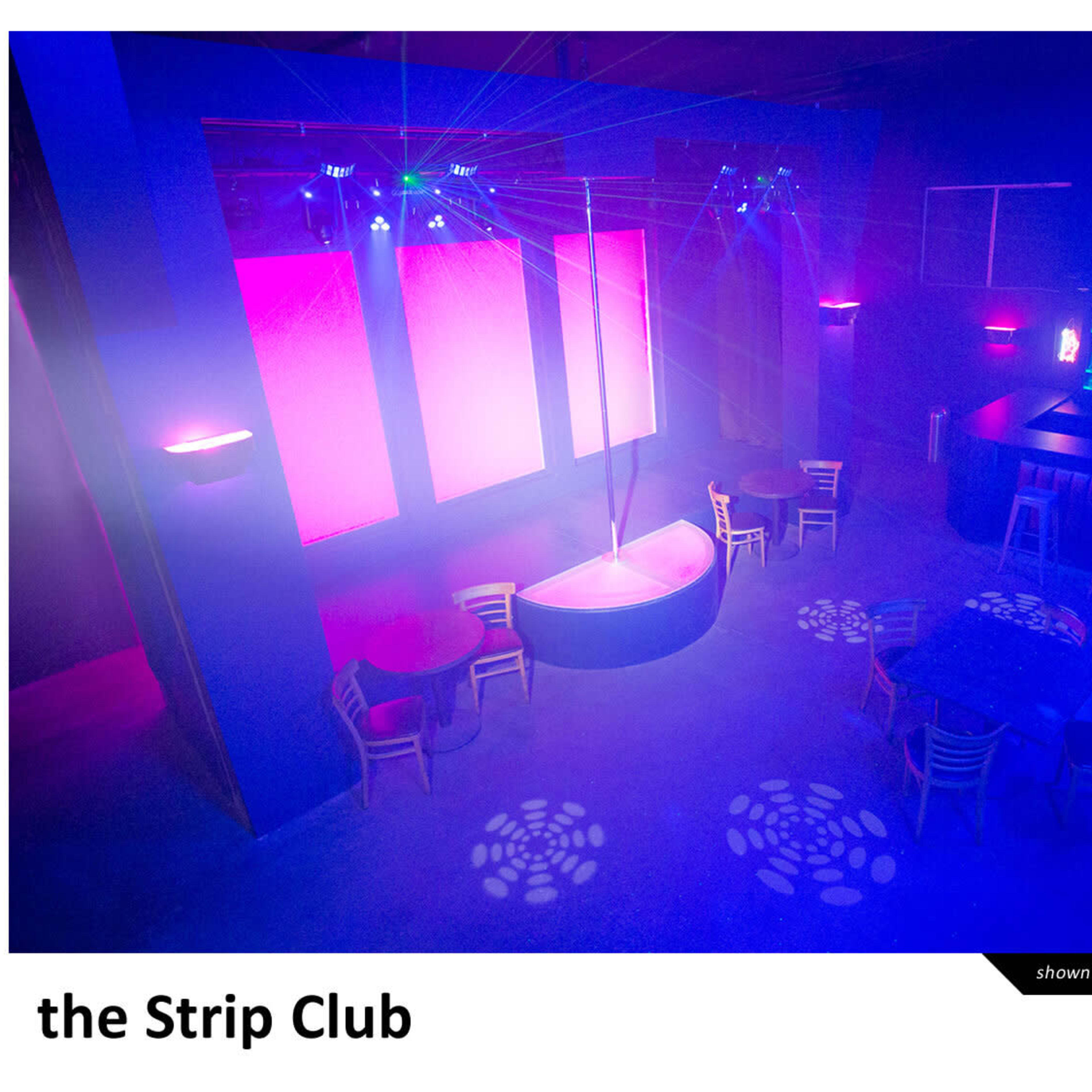 A dimly lit strip club featuring a central stage with a pole, surrounded by circular tables and a bar area with illuminated seating.