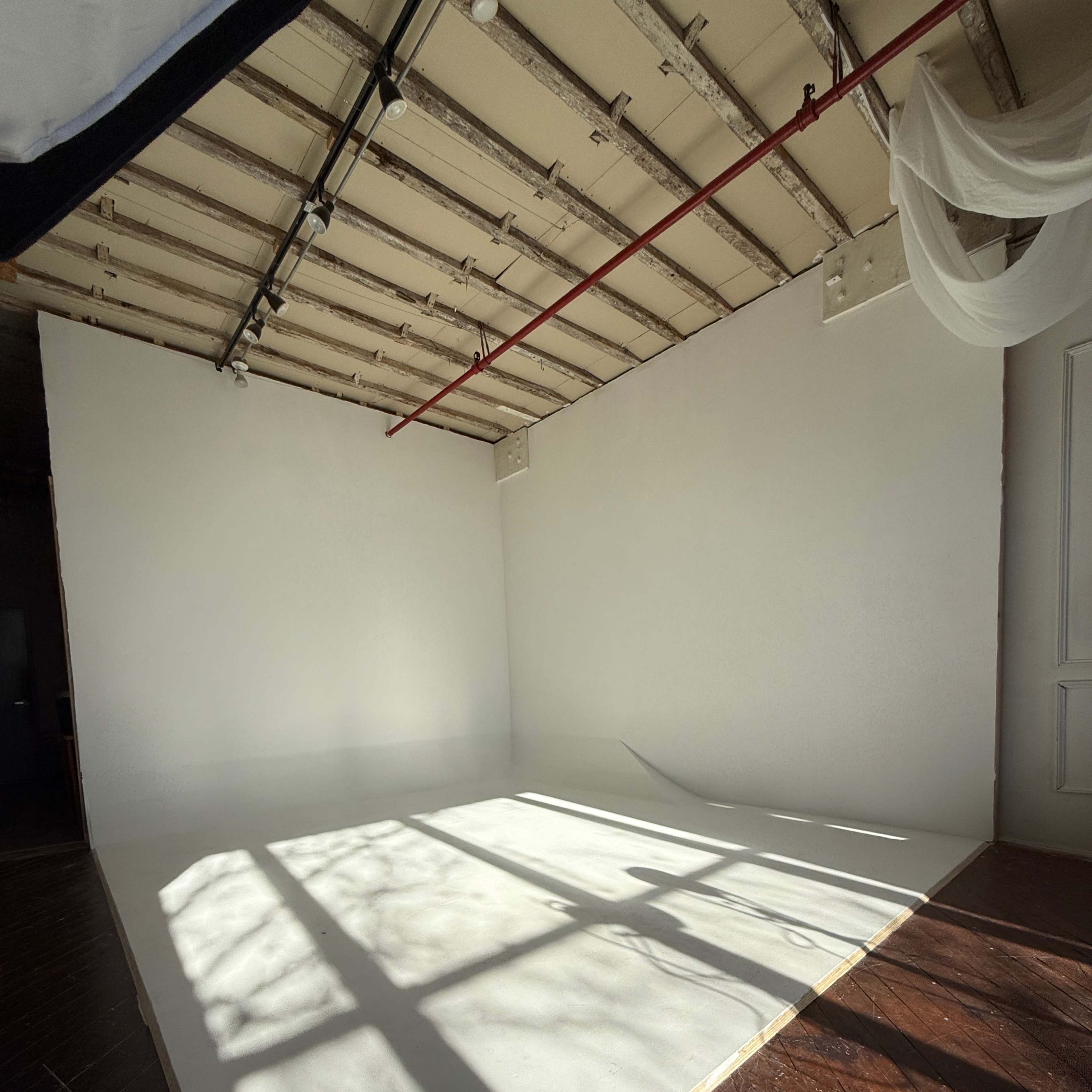 Photo and video studio rental. 750 sq ft space with 12' ceilings located on the edge of a vibrant area of Brooklyn, Industry City. Multiple stages & cyc wall. Equipment & props are included. Image in Sunset Park, Brooklyn, NY