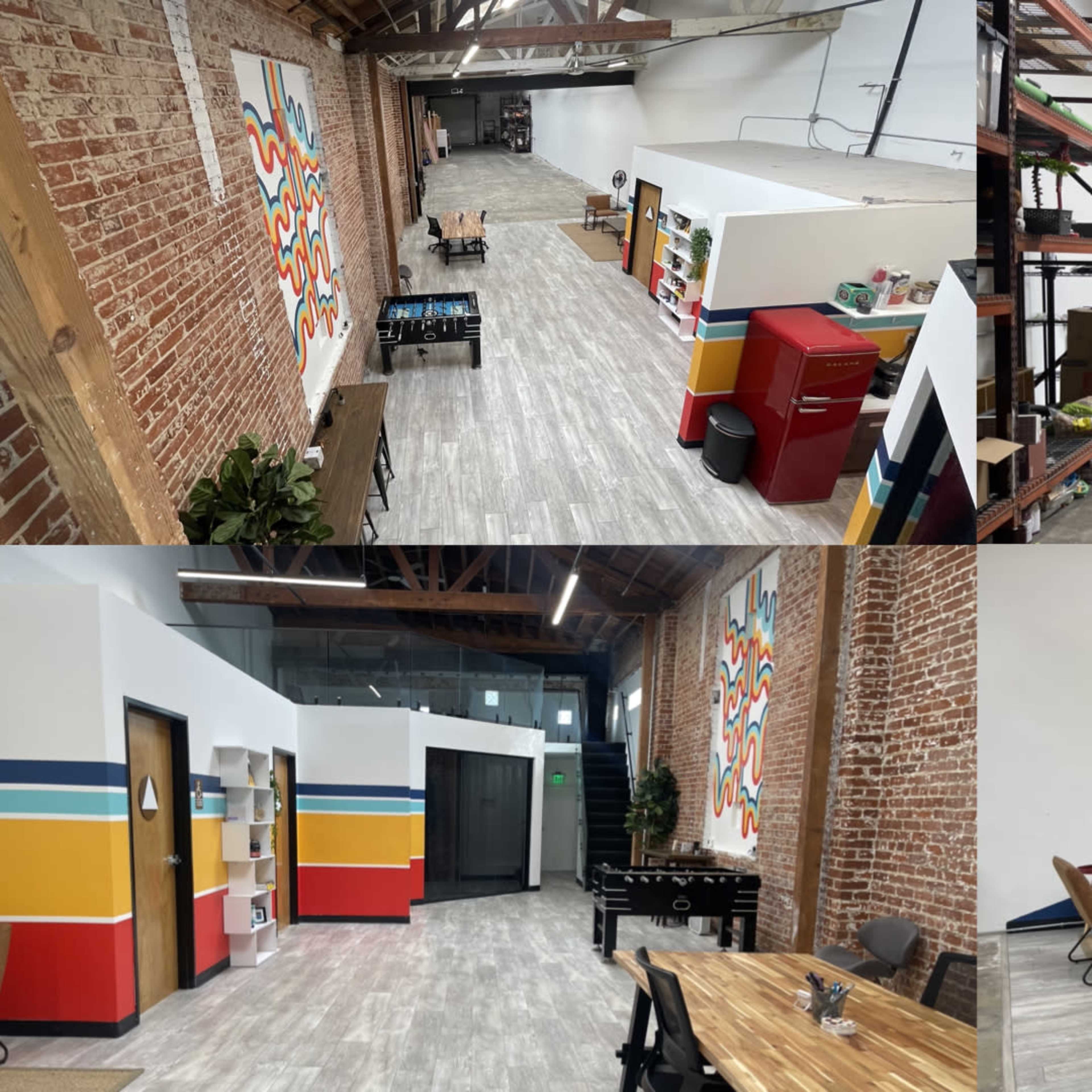 A spacious, industrial-style office with exposed brick walls, wooden flooring, and various design elements like colorful wall art and shelving.