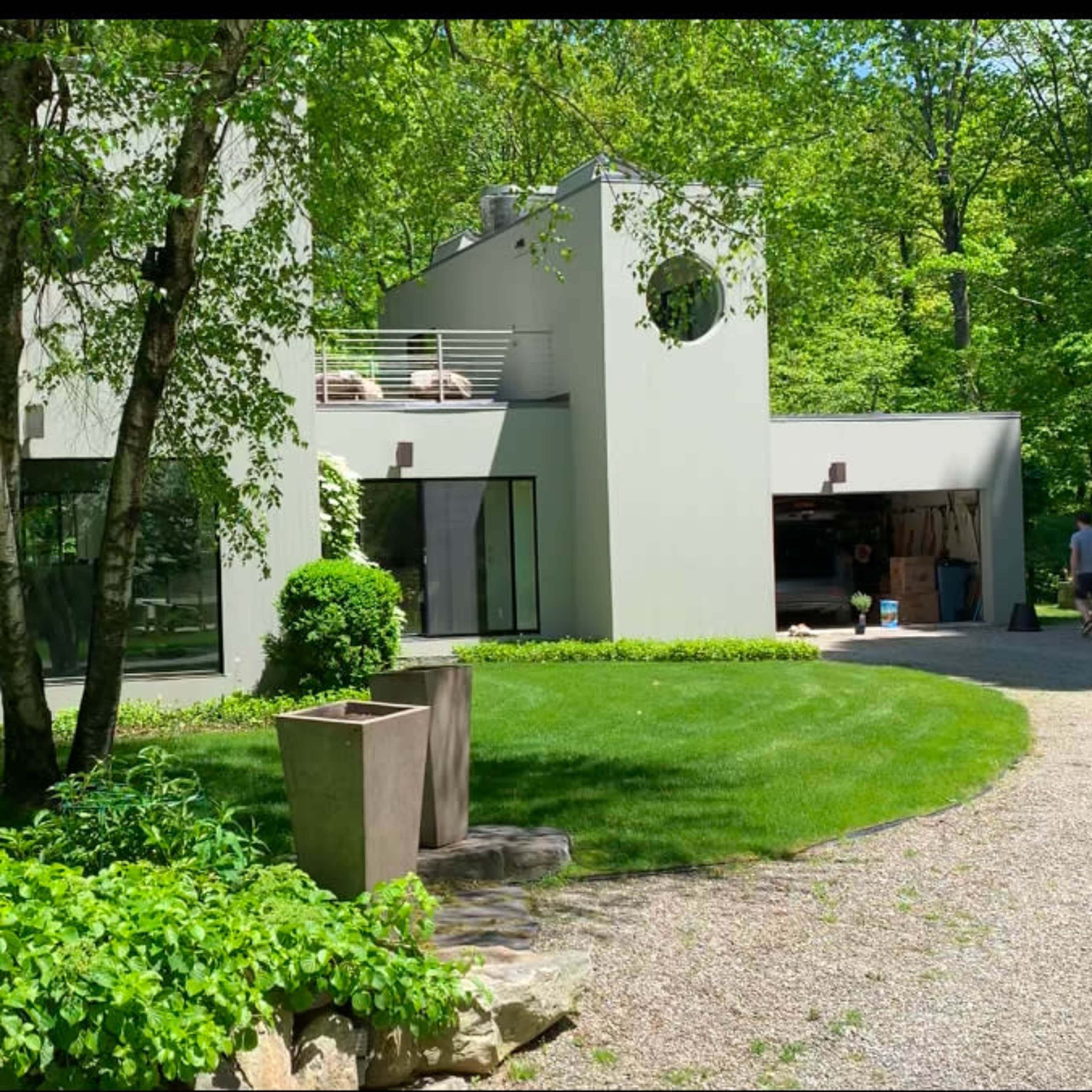 Mid Century modern country house situated on a brook on over 5 secluded, wooded acres in the Hudson Valley, including 2 acres of curated botanical gardens Image in Philipstown, Philipstown, NY