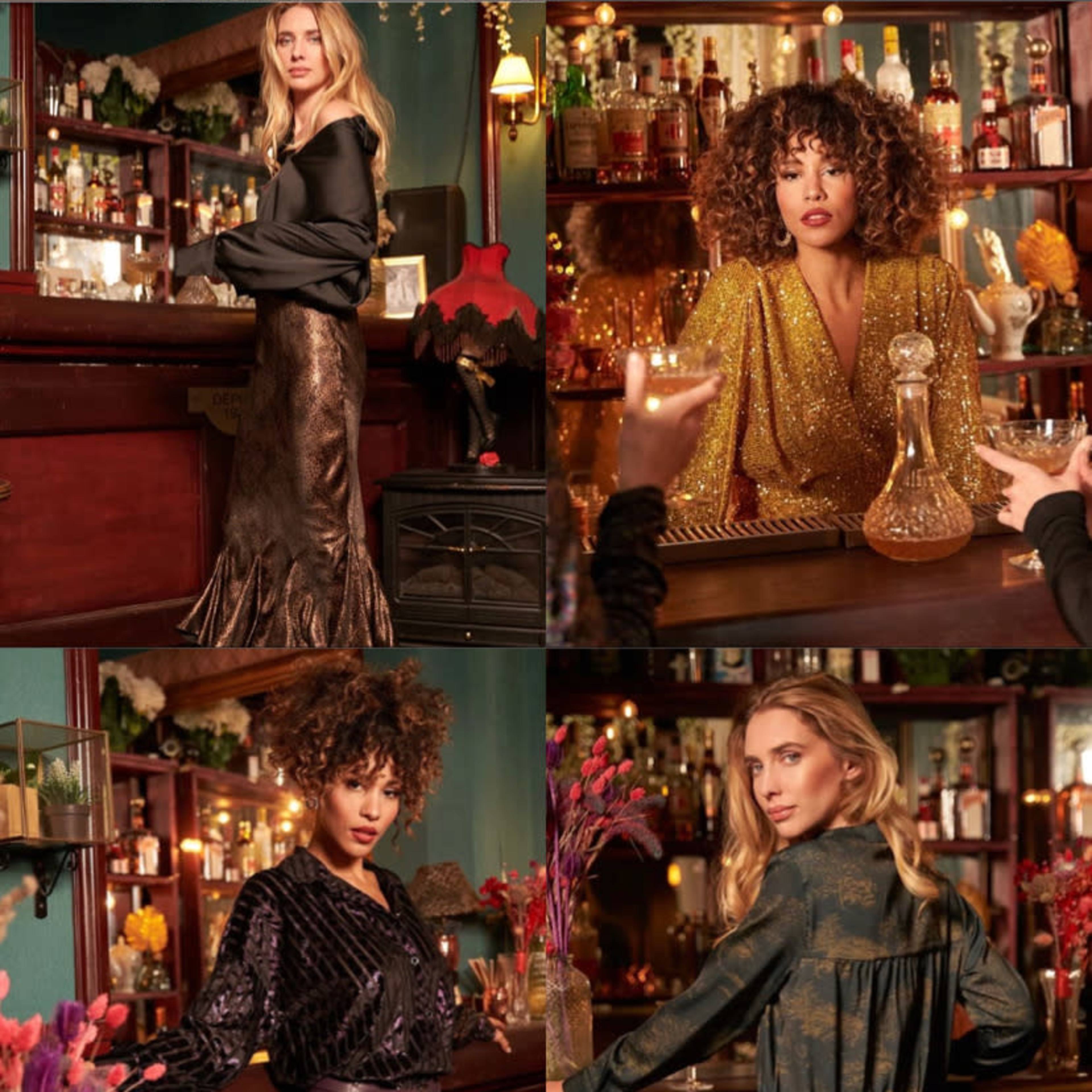 Six stylish women posing in a vibrant bar setting, showcasing a variety of fashionable outfits against a backdrop of colorful decor and shelves filled with spirits.
