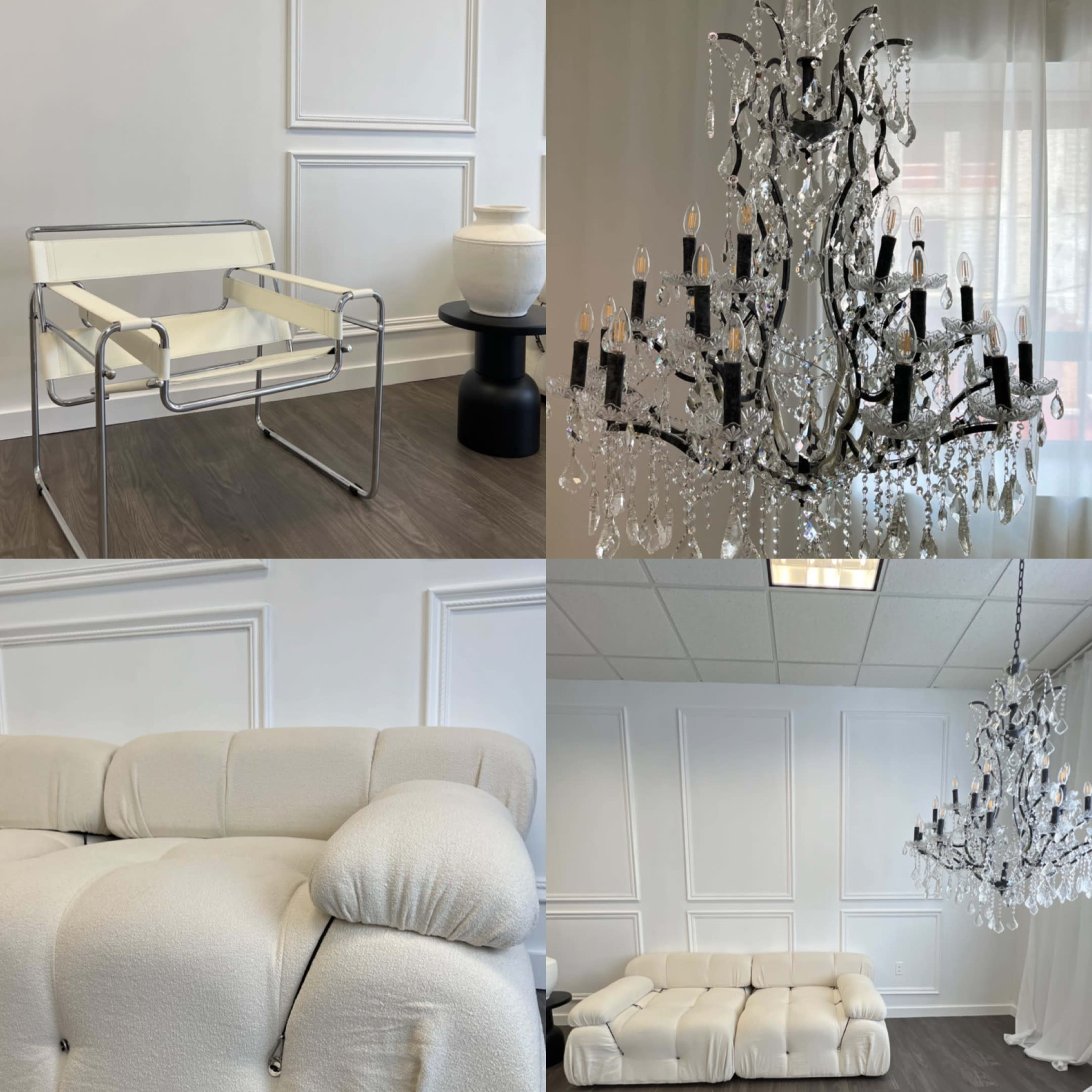 A modern interior with a white and neutral color palette, showcasing a minimalist seating area, two ornate chandeliers, a plush couch, and a white decorative fireplace.
