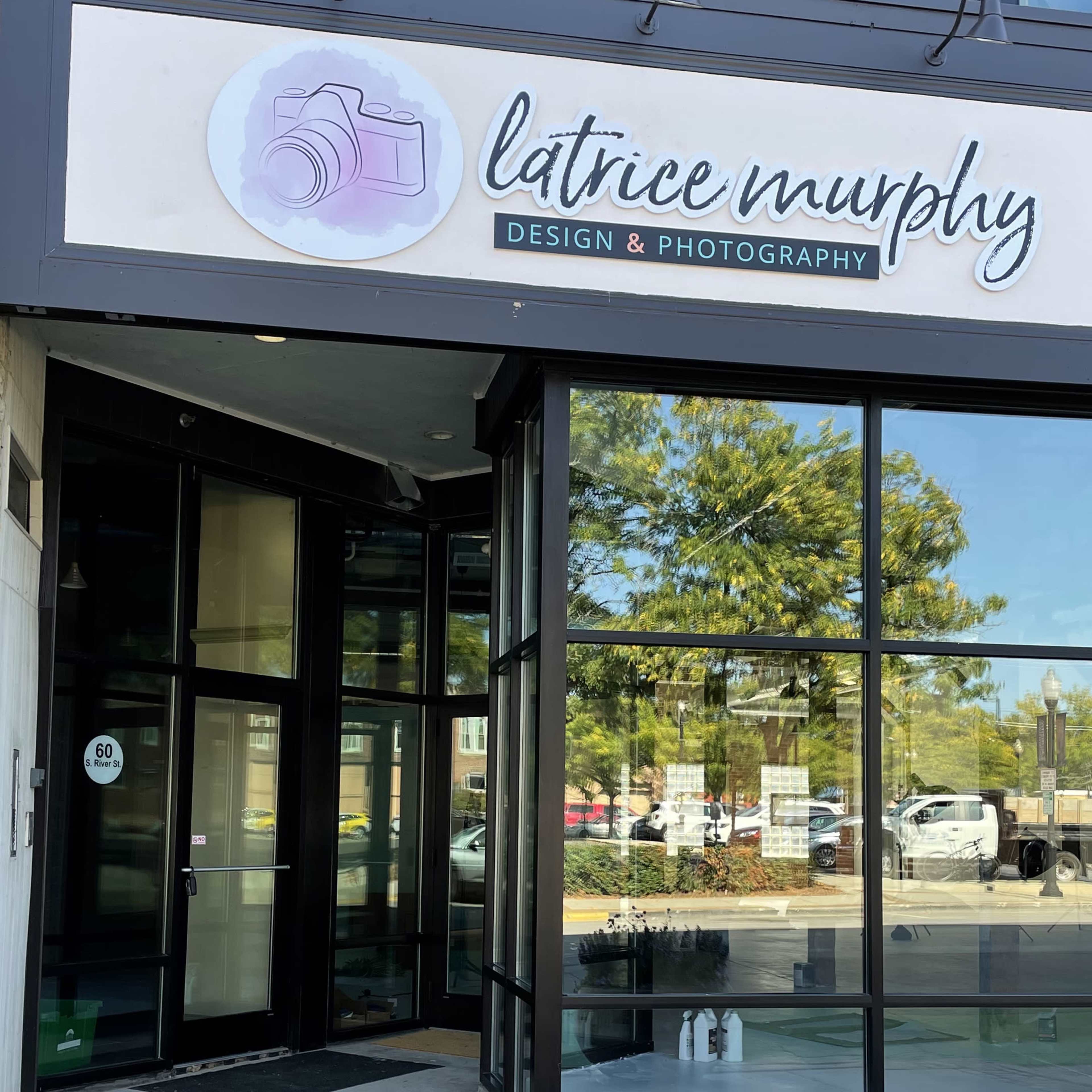 The entrance to a photography studio is marked by a sign that reads "latrice murphy Design & Photography."