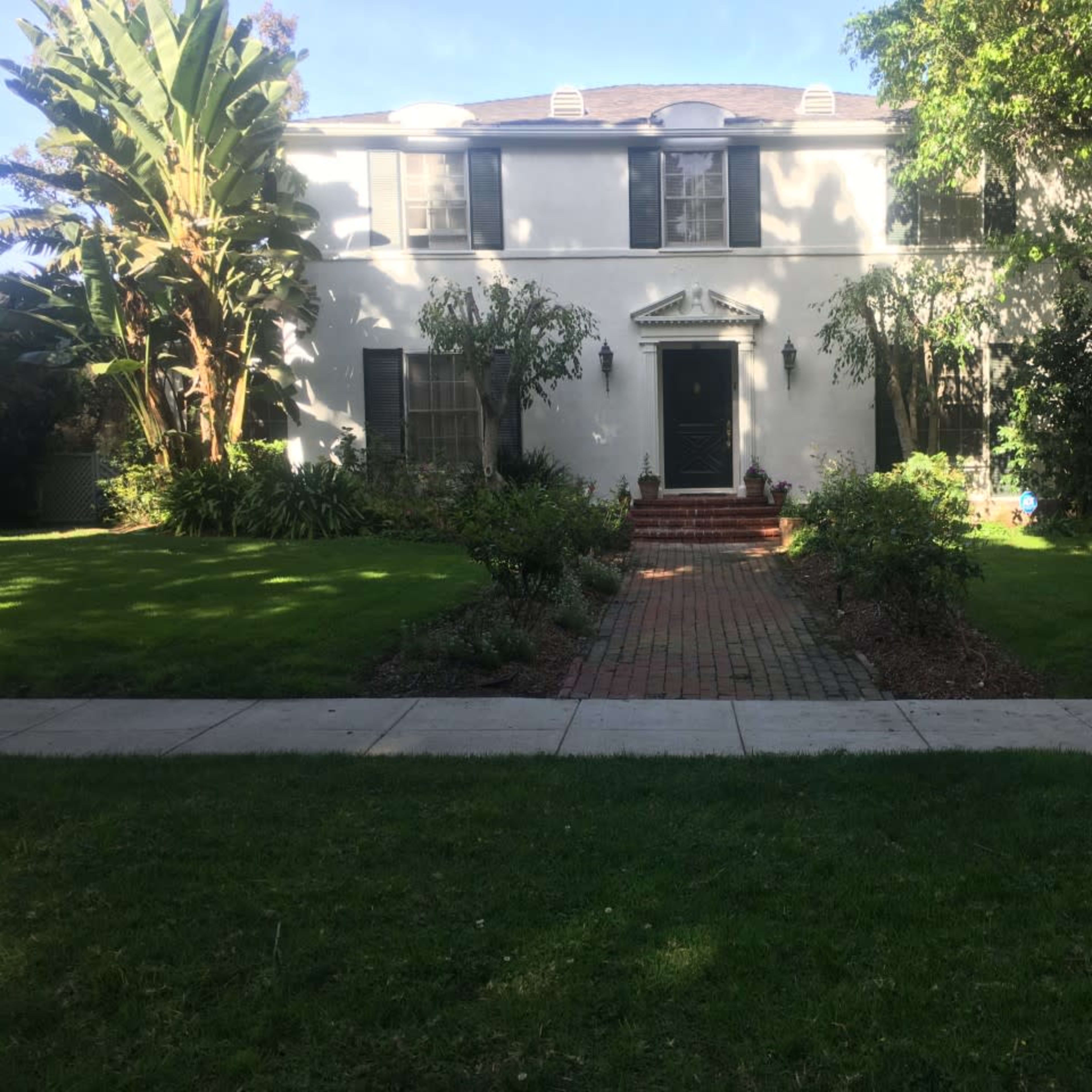 Classic Beverly Hills 90210 house with lush backyard and pool. Image in The Flats, Beverly Hills, CA