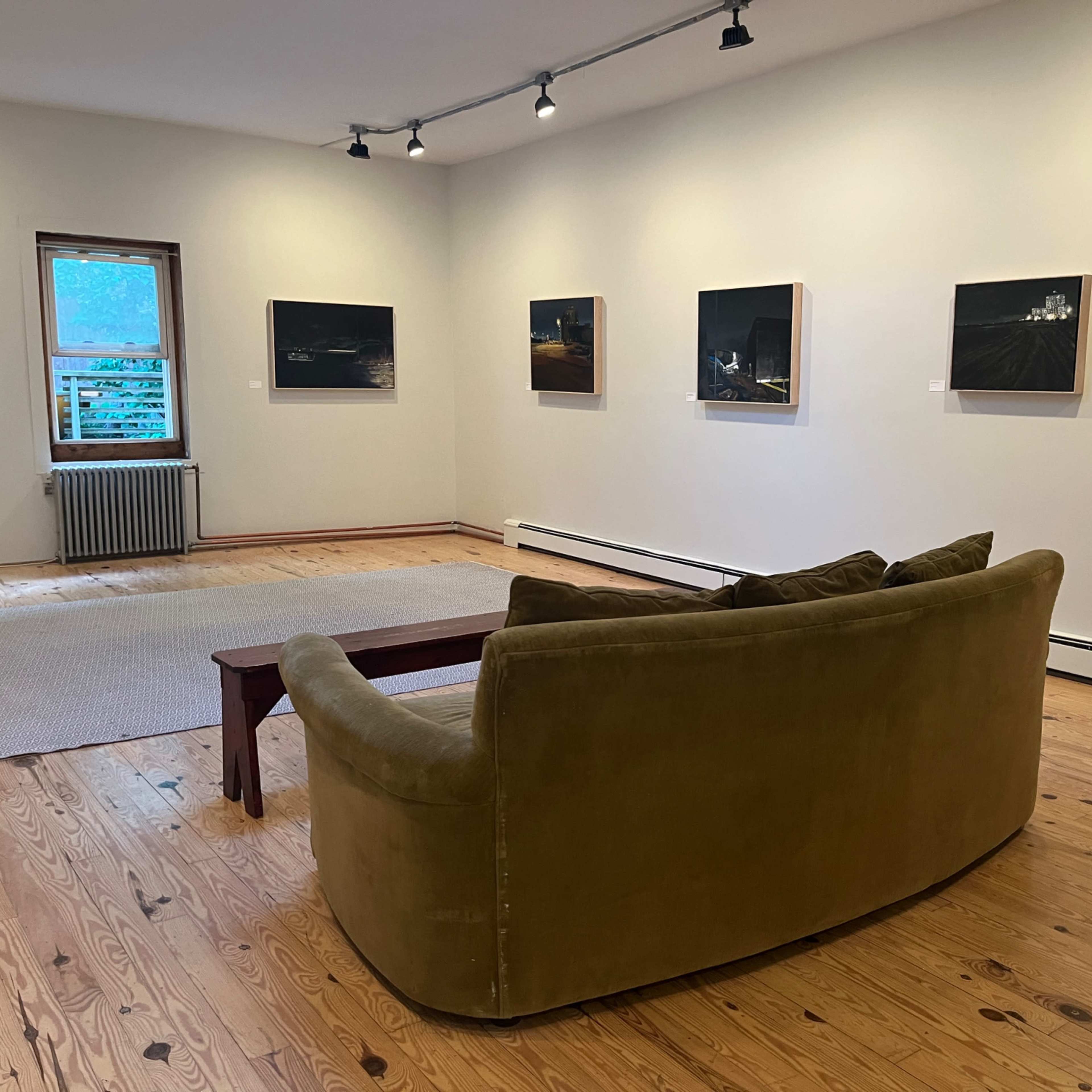Large open room with gallery lighting and adjacent full kitchen. Image in Windsor Terrace, Brooklyn, NY