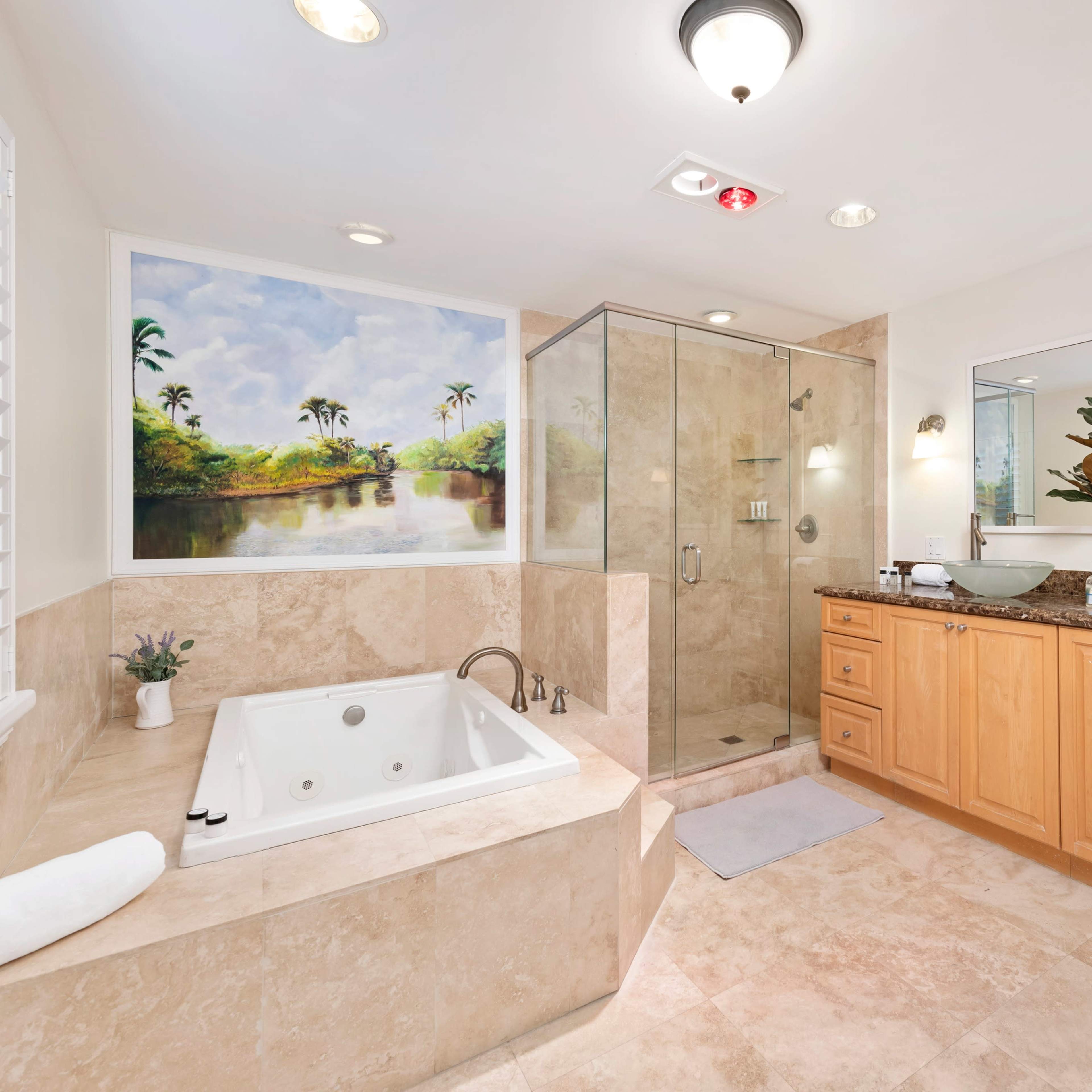 A modern bathroom featuring a glass shower, a jetted tub, wooden cabinetry, and a mural of a tropical landscape on the wall.