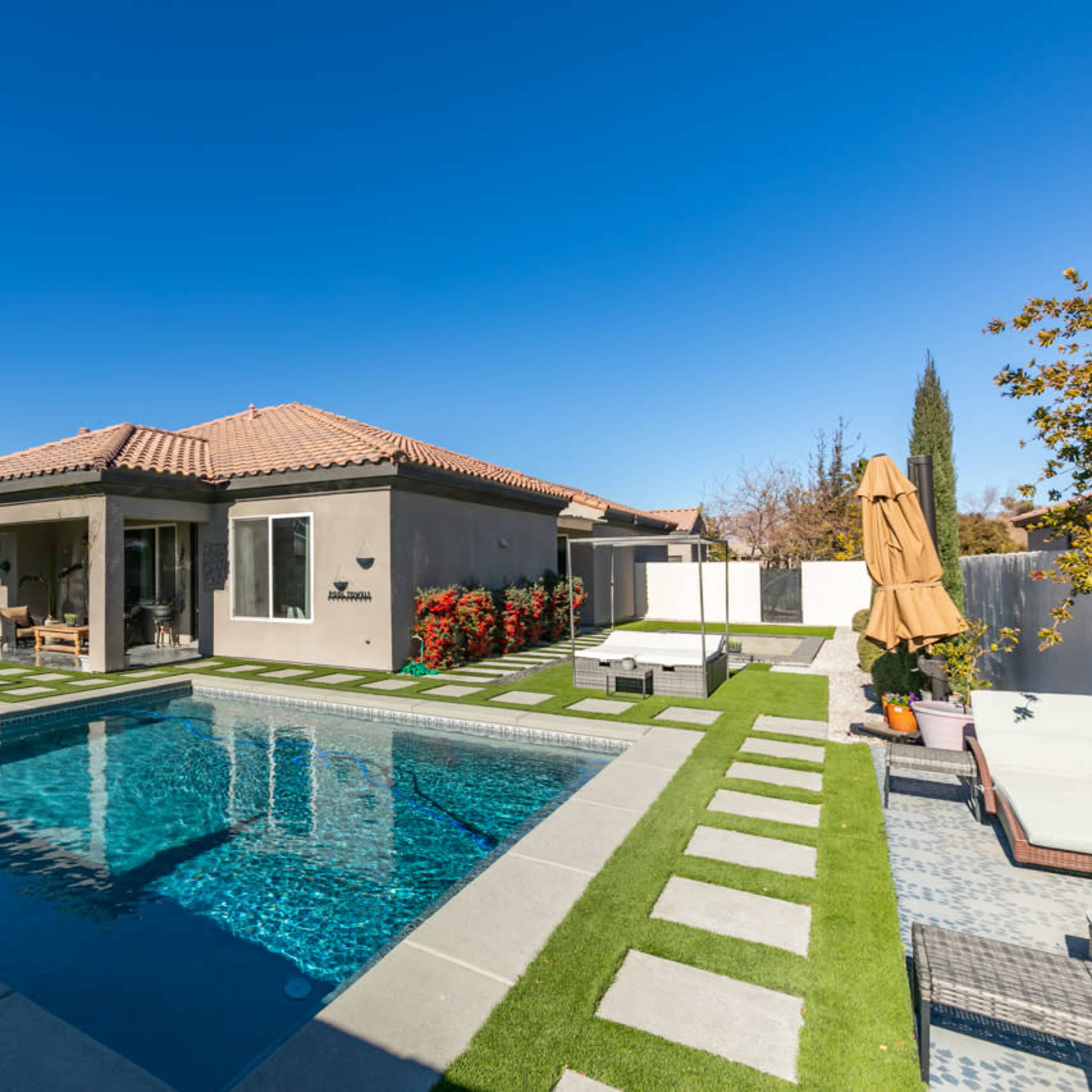 Whimsical Private backyard with pool , patio, fire pit in quiet North West Las Vegas neighborhood. Image in Wyeth Ranch, Las Vegas, NV