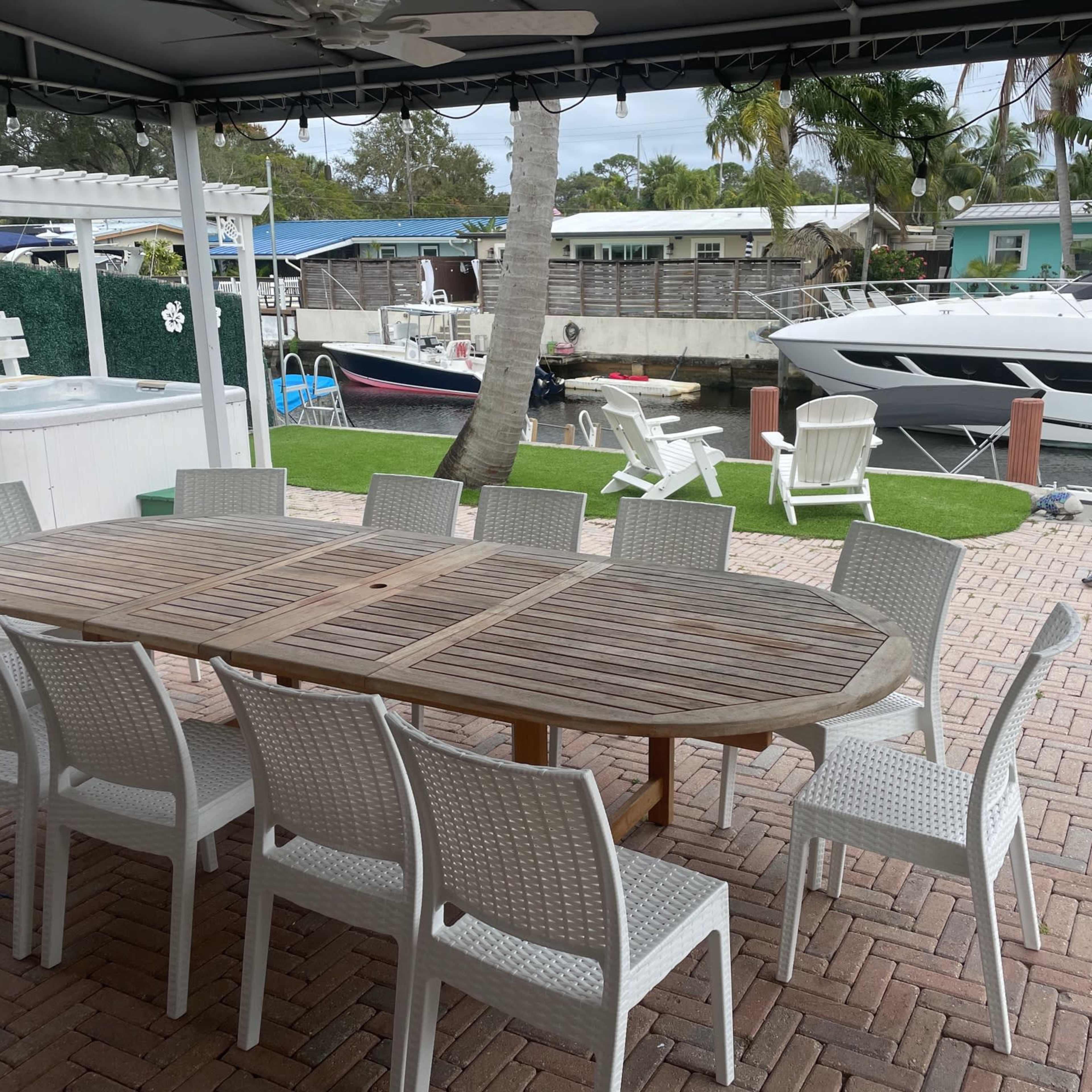 Waterfront East Fort Lauderdale Outdoor Dining Space with Kitchen Dock Firepit Half Bath Image in Shady Banks, Fort Lauderdale, FL
