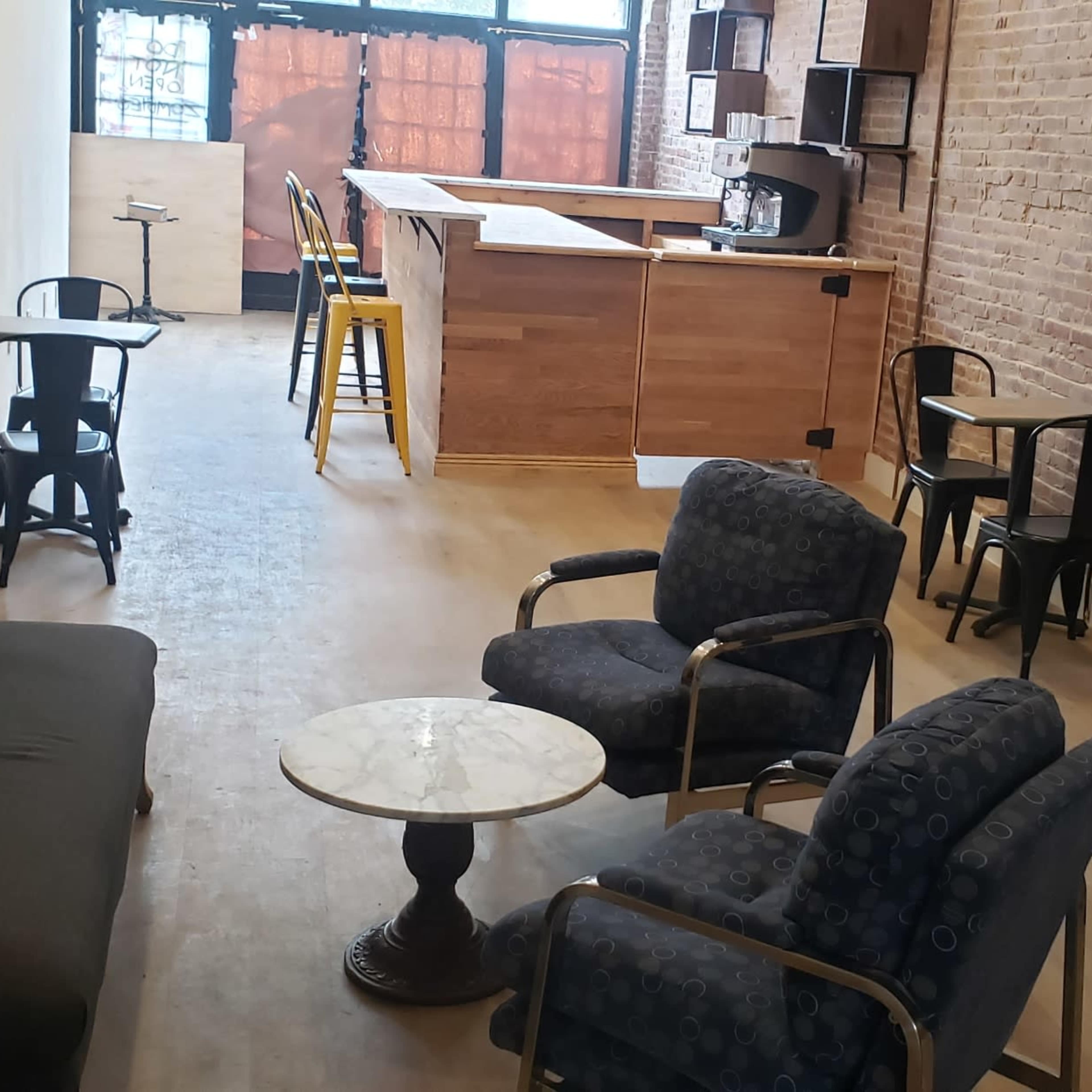 Urban lofty space with high ceilings includes an outdoor patio and built in bar counter, bathroom, food storage and prep space. Image in Bedford-Stuyvesant, Brooklyn, NY
