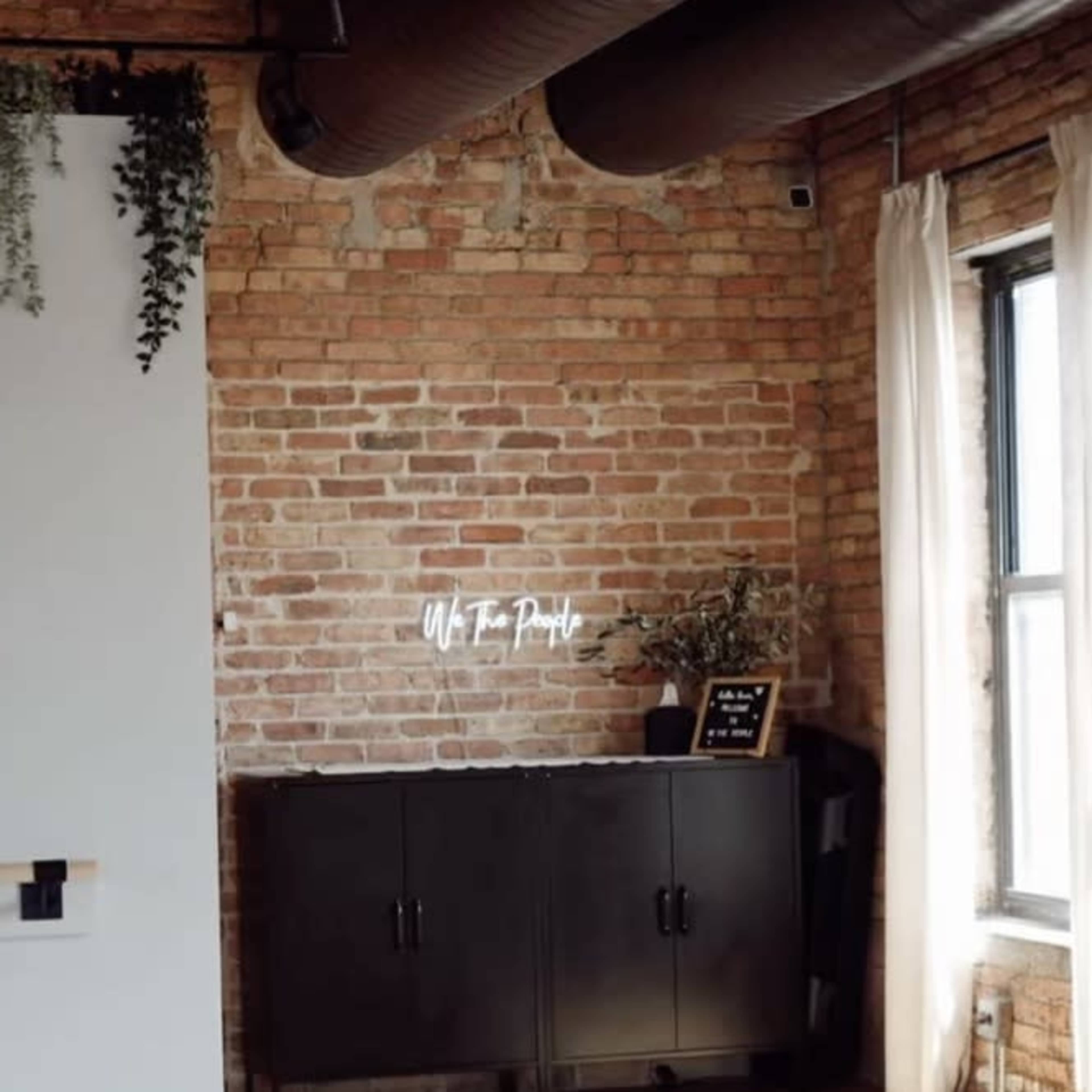 Beautiful timber loft fitness studio with equipment, skyline view and outdoor space. Image in Near North Side, Chicago, IL