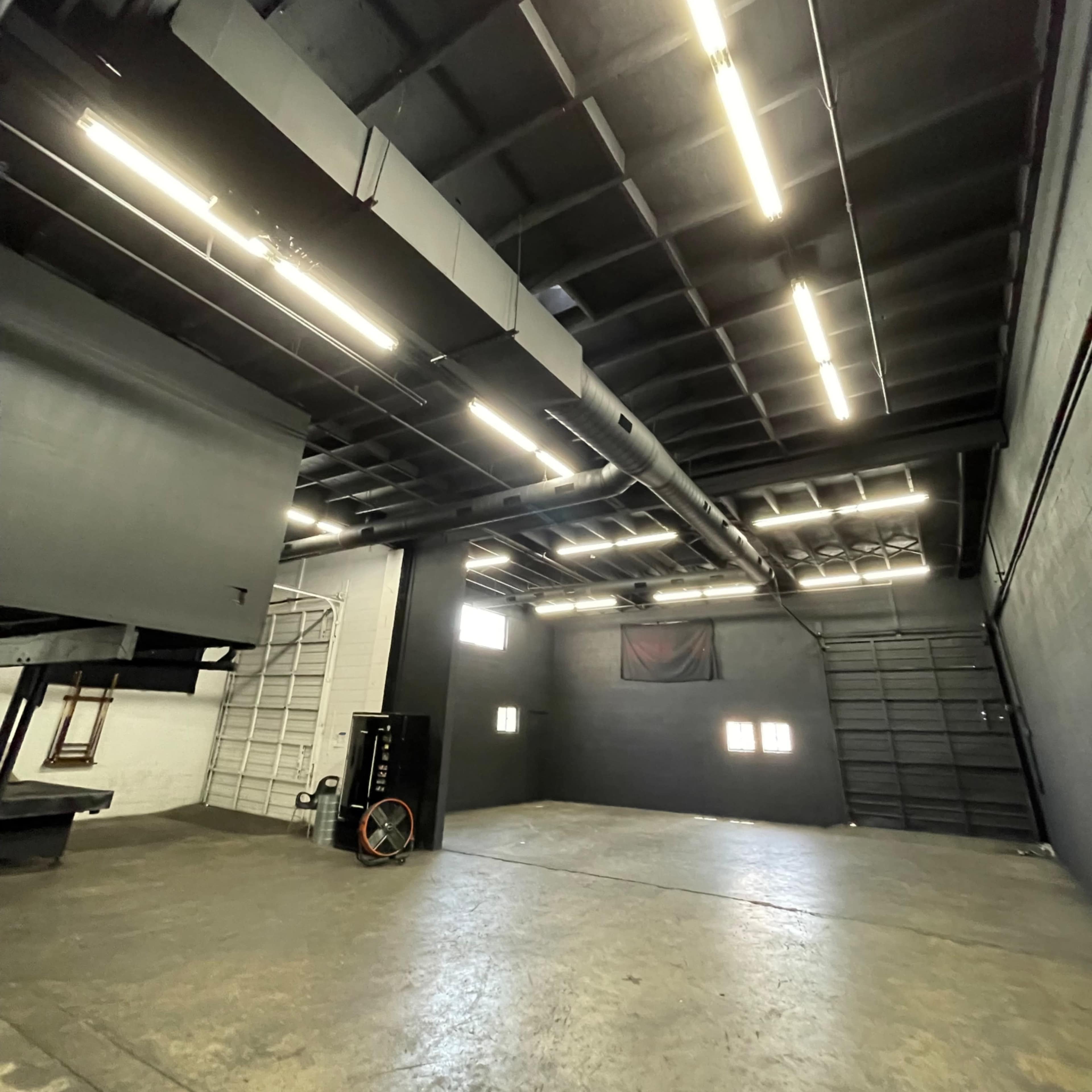 Warehouse with Black Walls, Tall Garage Doors And AC Image in South Montebello, Montebello, CA