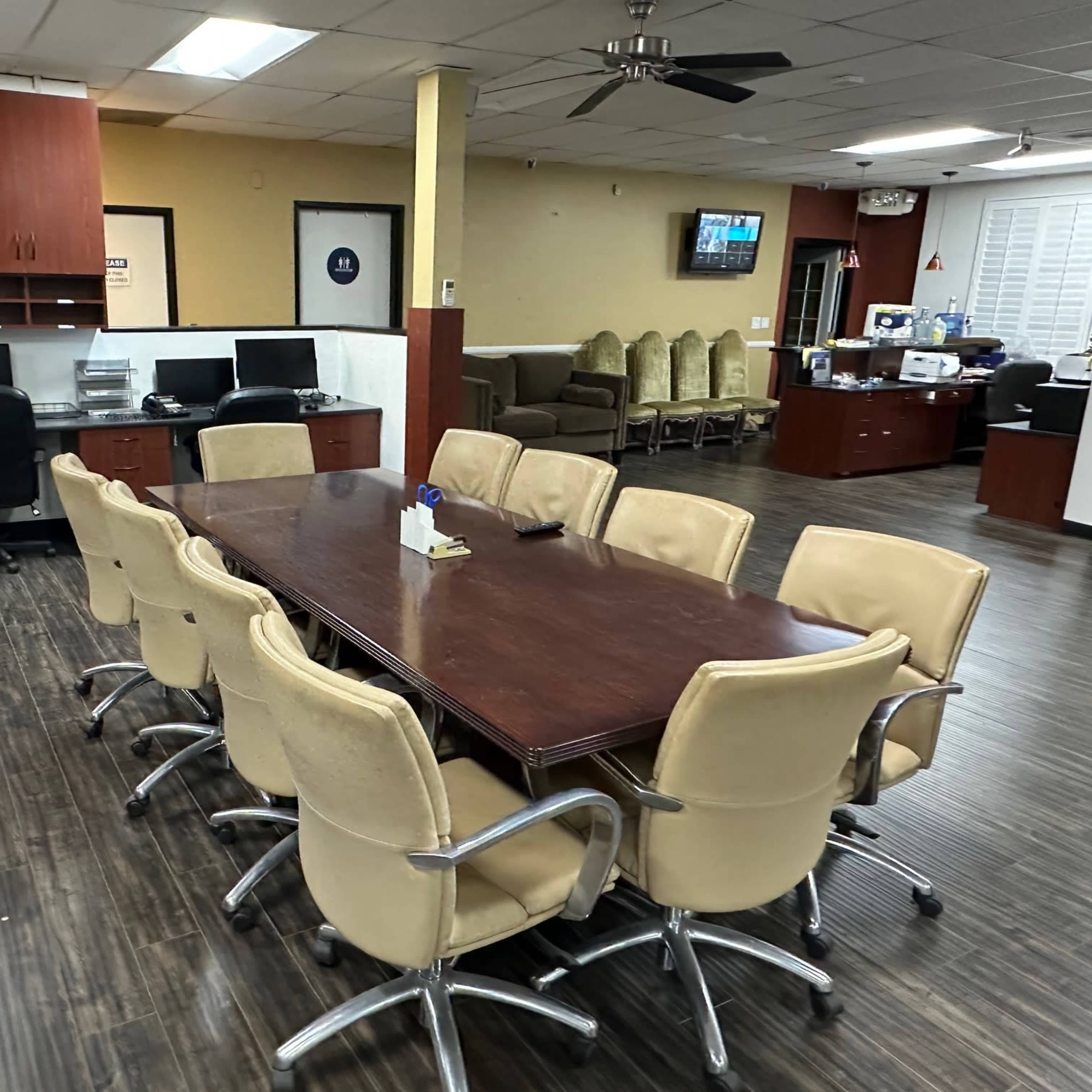 Office film sets include conference table, reception desk, boss office, executive office and workstations.  HMU and wardrobe/changing rooms. Roof top access. Image in Canoga Park, Los Angeles, CA