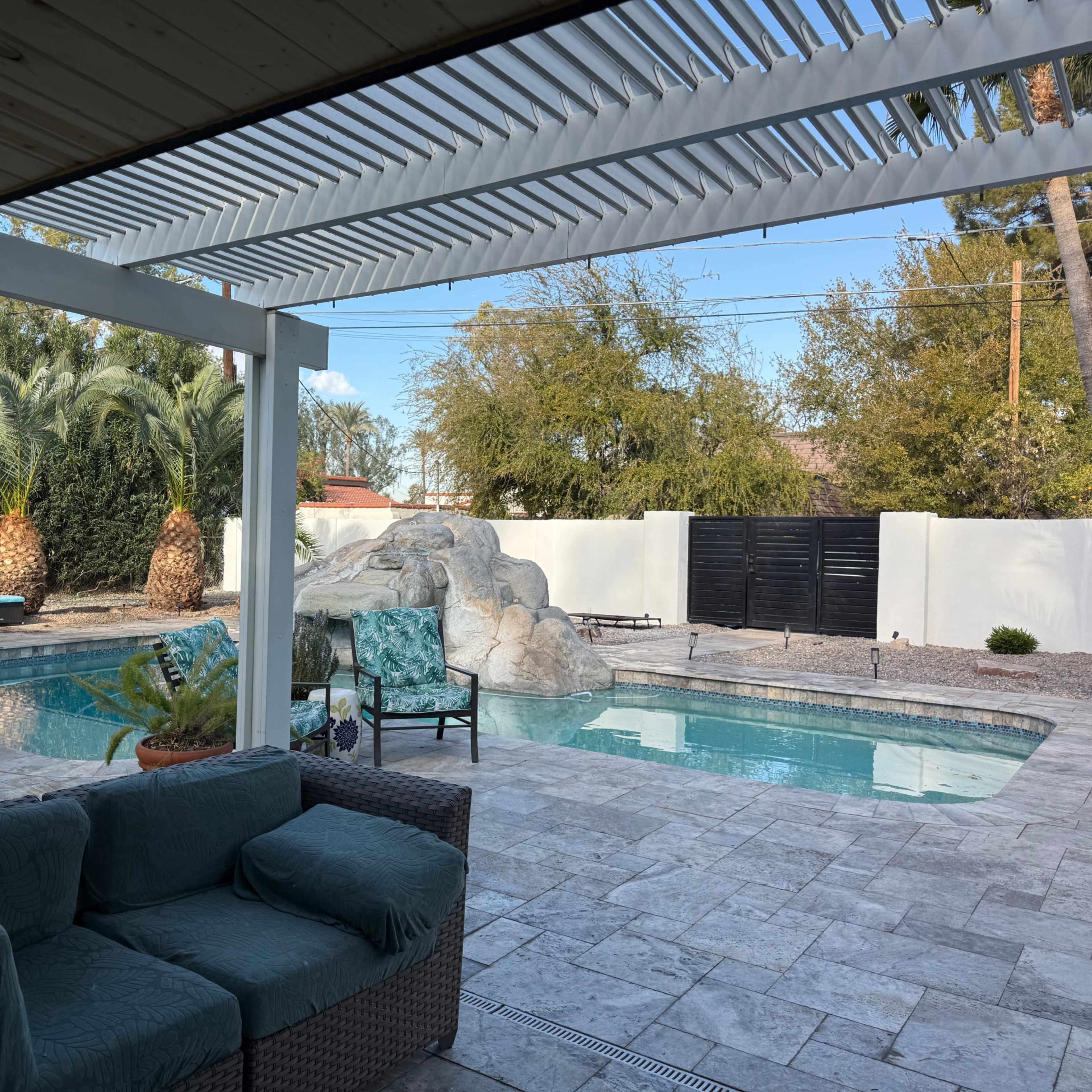 Newly redone modern mid-century ranch home with lush walled in garden, putting green and views of Camelback mountain- pool and waterfall slide- an oasis in the desert Image in Camelback East Village, Phoenix, AZ