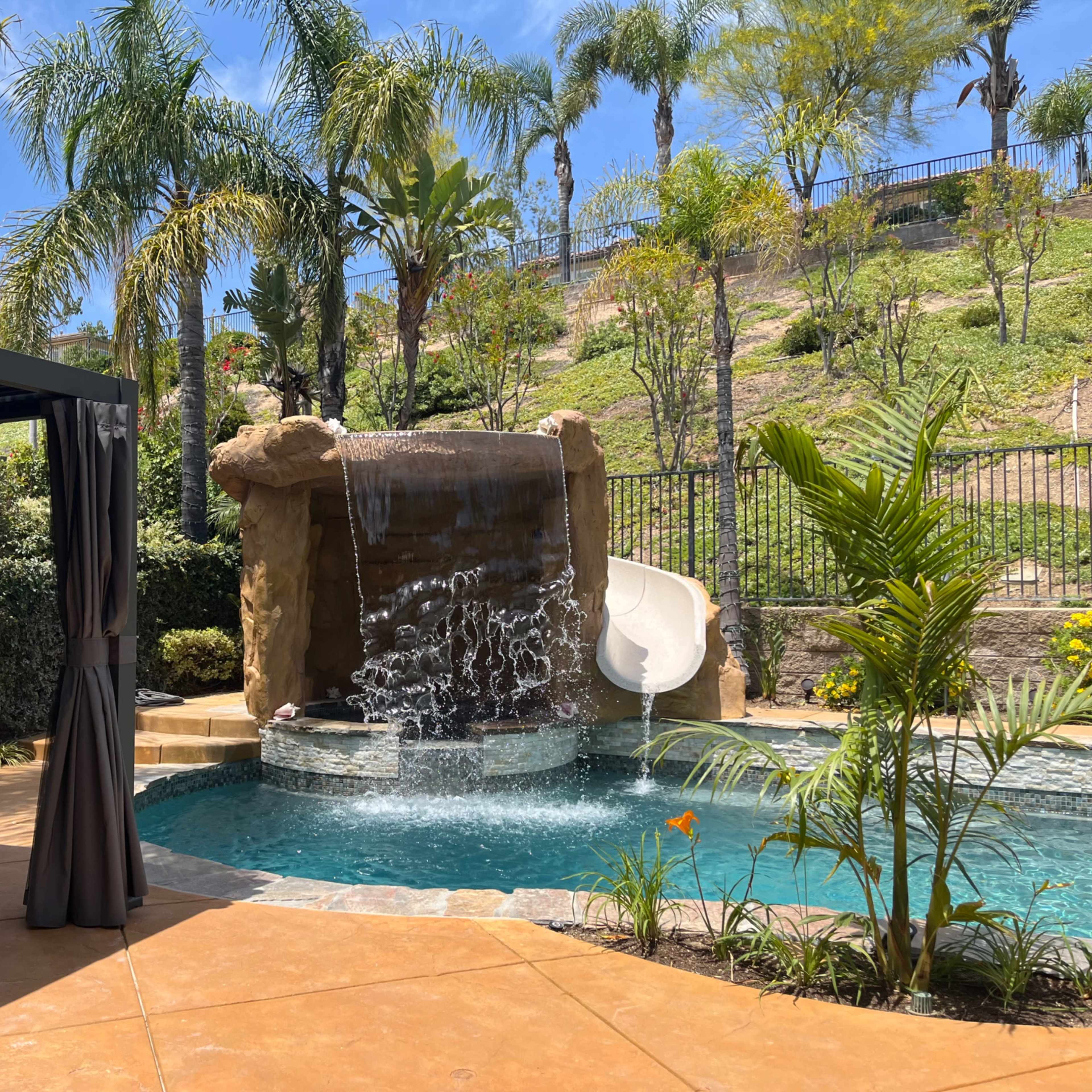 Porter Ranch Oasis with Grotto Waterfall and Slide Image in Chatsworth, Los Angeles, CA