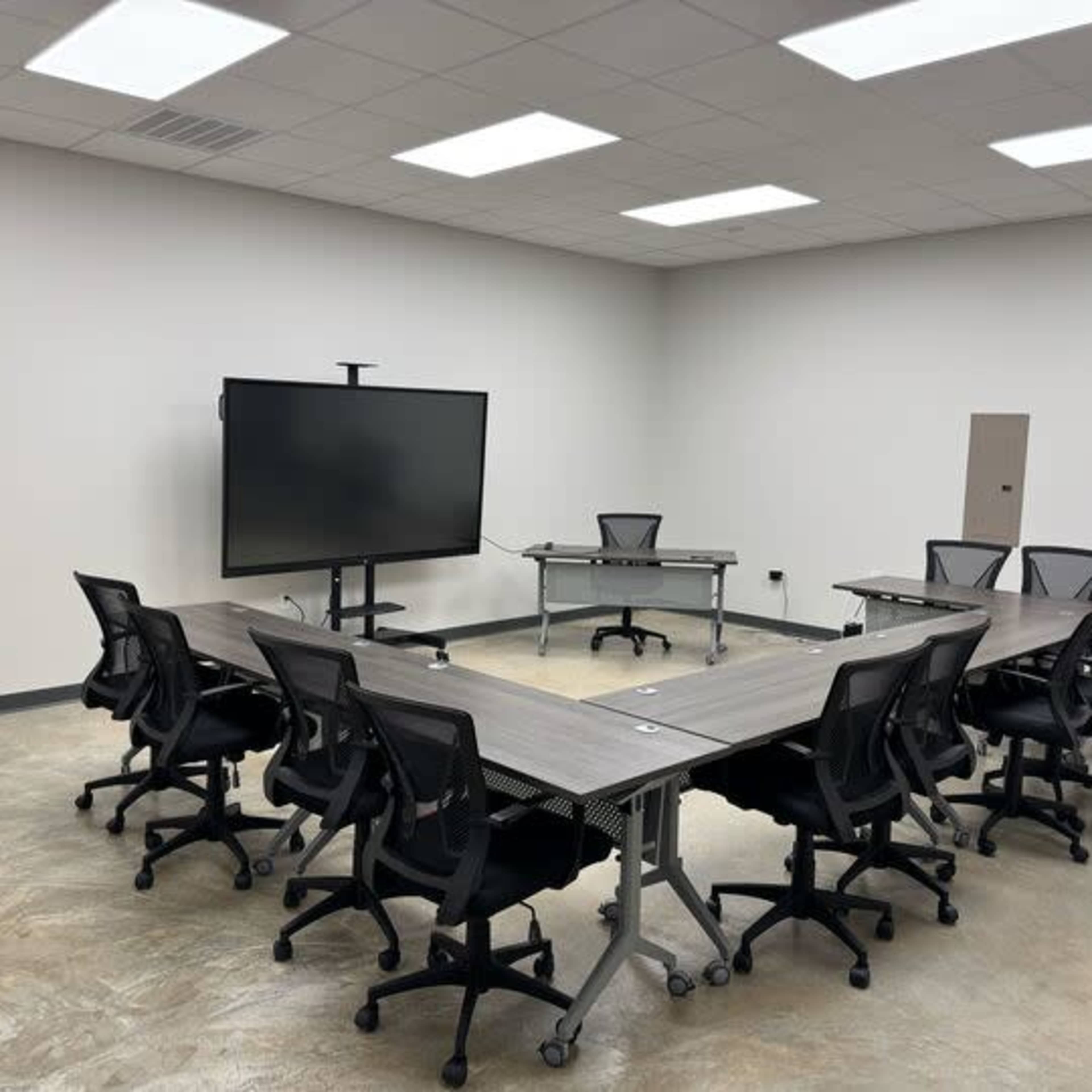 Industrial Boardroom | Seats 12 | 86" Smart Board Image in Conroy Park, Manchaca, TX