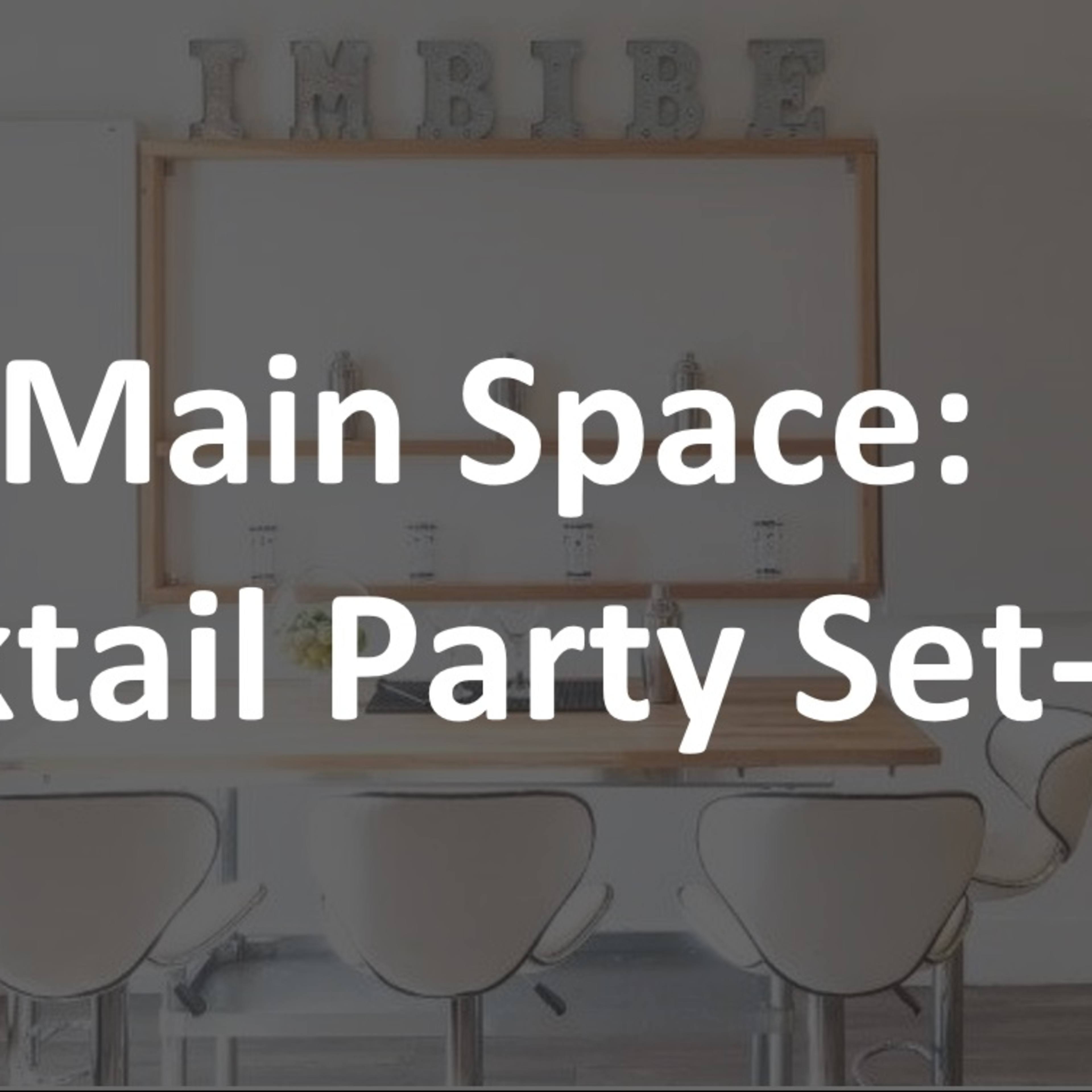 A modern dining area arranged for a cocktail party, with a long table, chairs, and decorative elements prominently displayed.