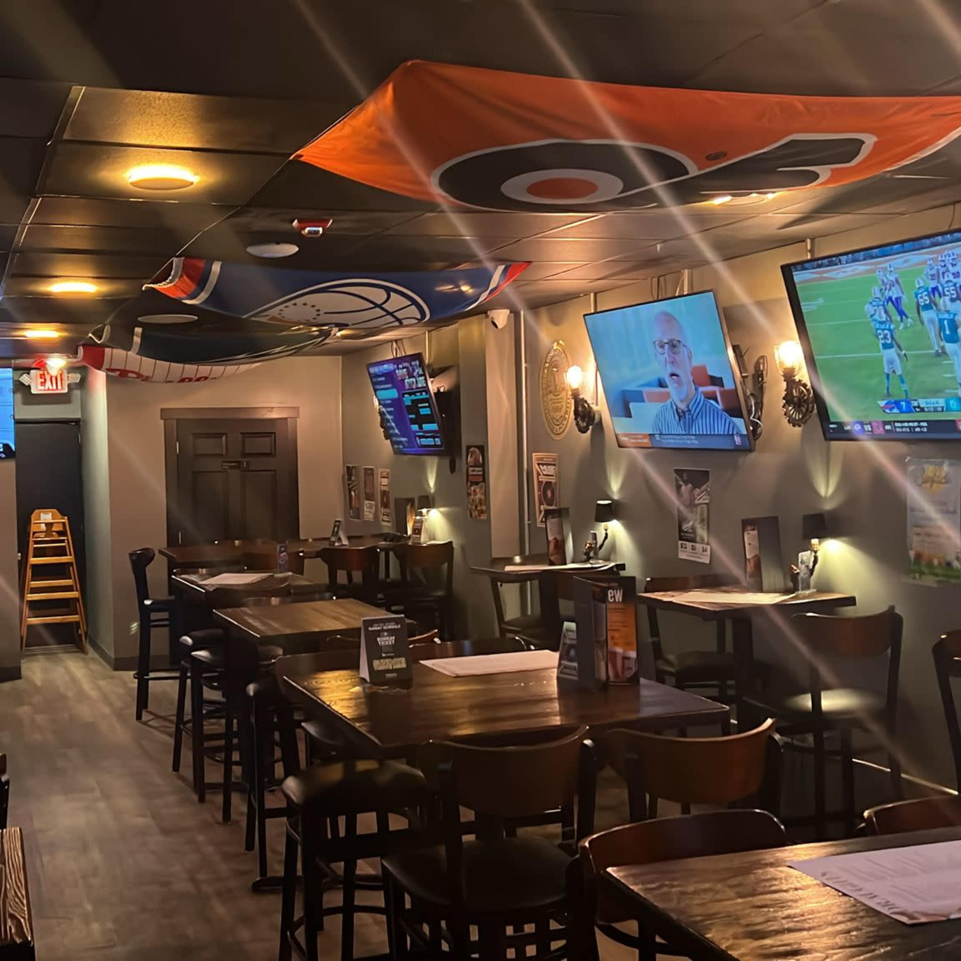 Cozy bar area with 10 flat screen TVs and surround sound speakers Image in Roxborough-Manayunk, Philadelphia, PA